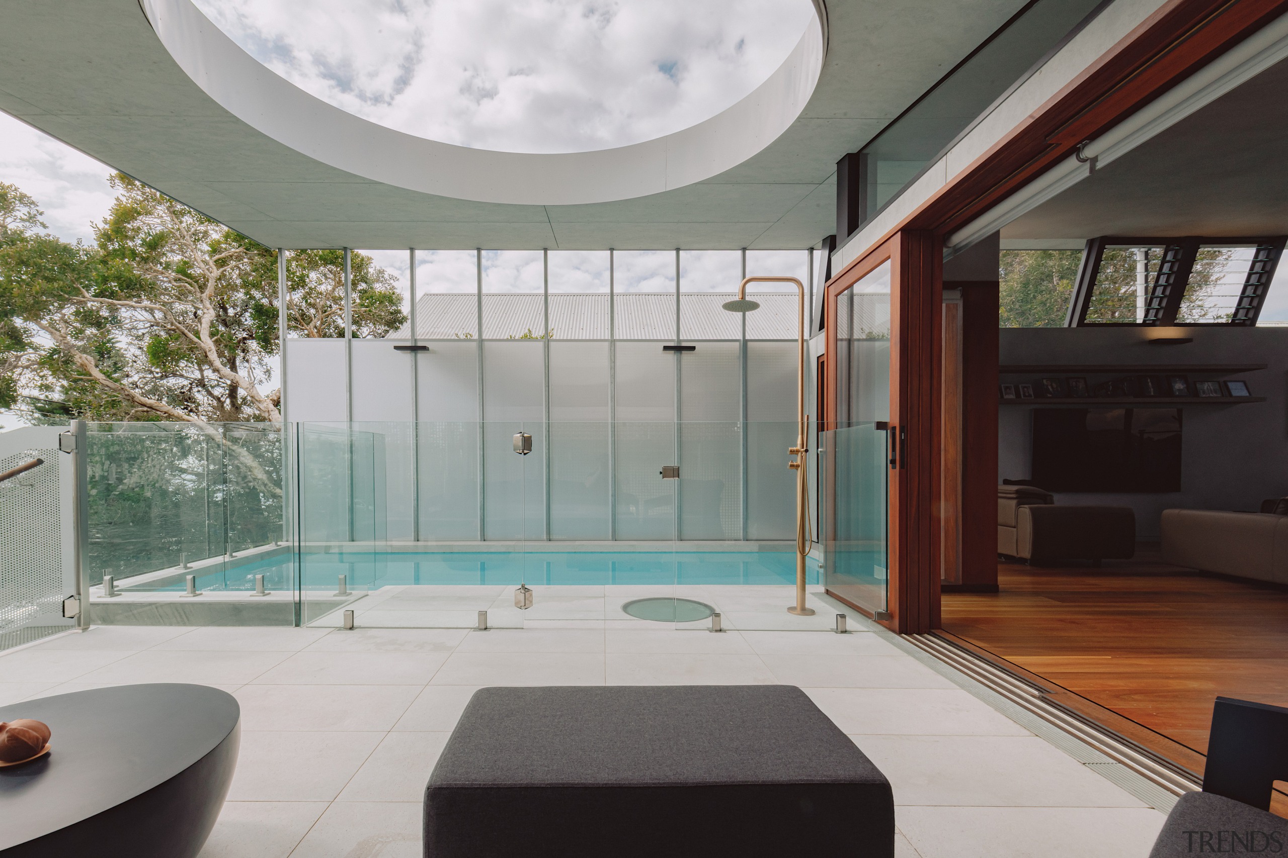 The covered outdoor living space and pool area 