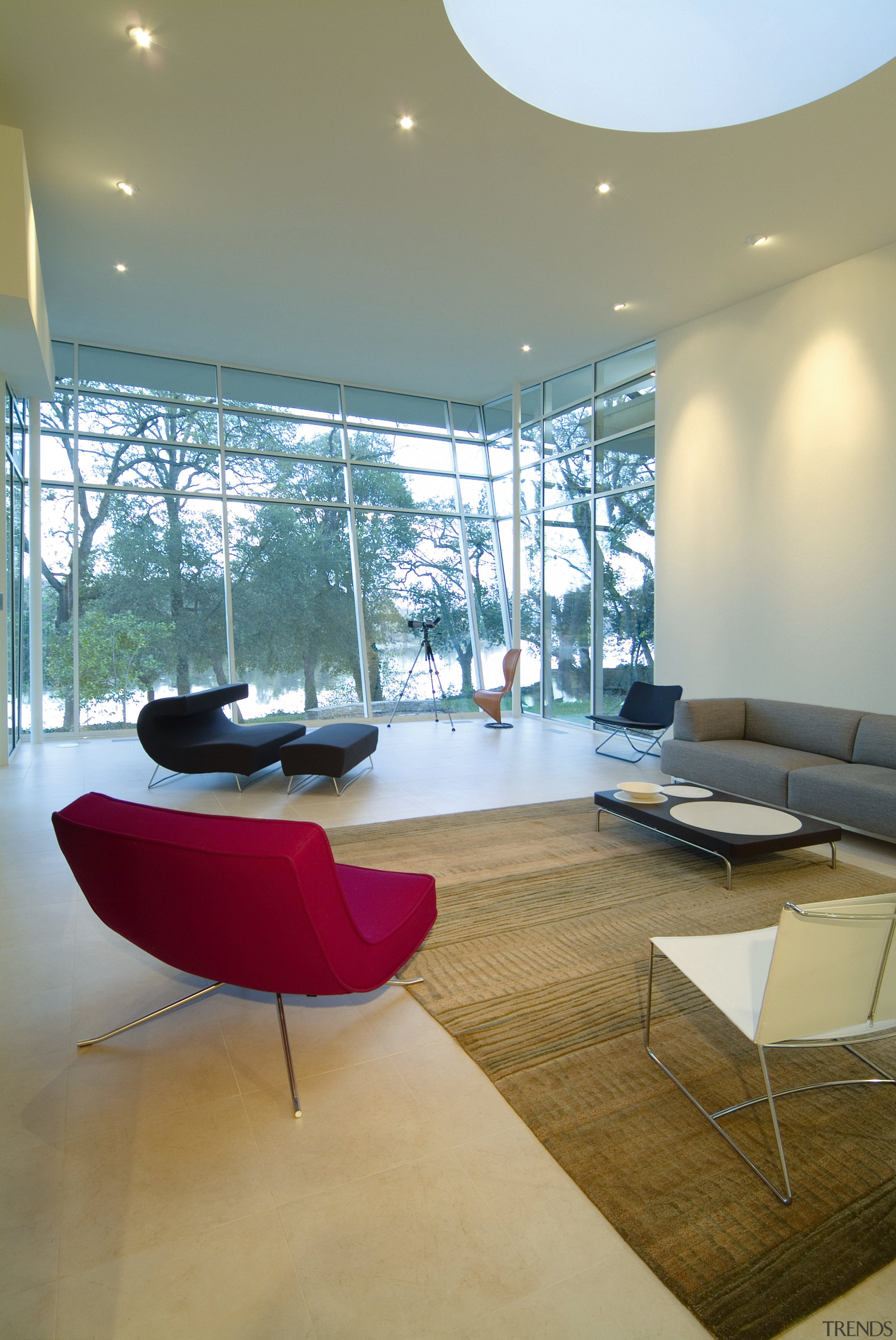 A view of the living area, stone floors, architecture, ceiling, chair, daylighting, floor, flooring, furniture, house, interior design, living room, product design, table, orange