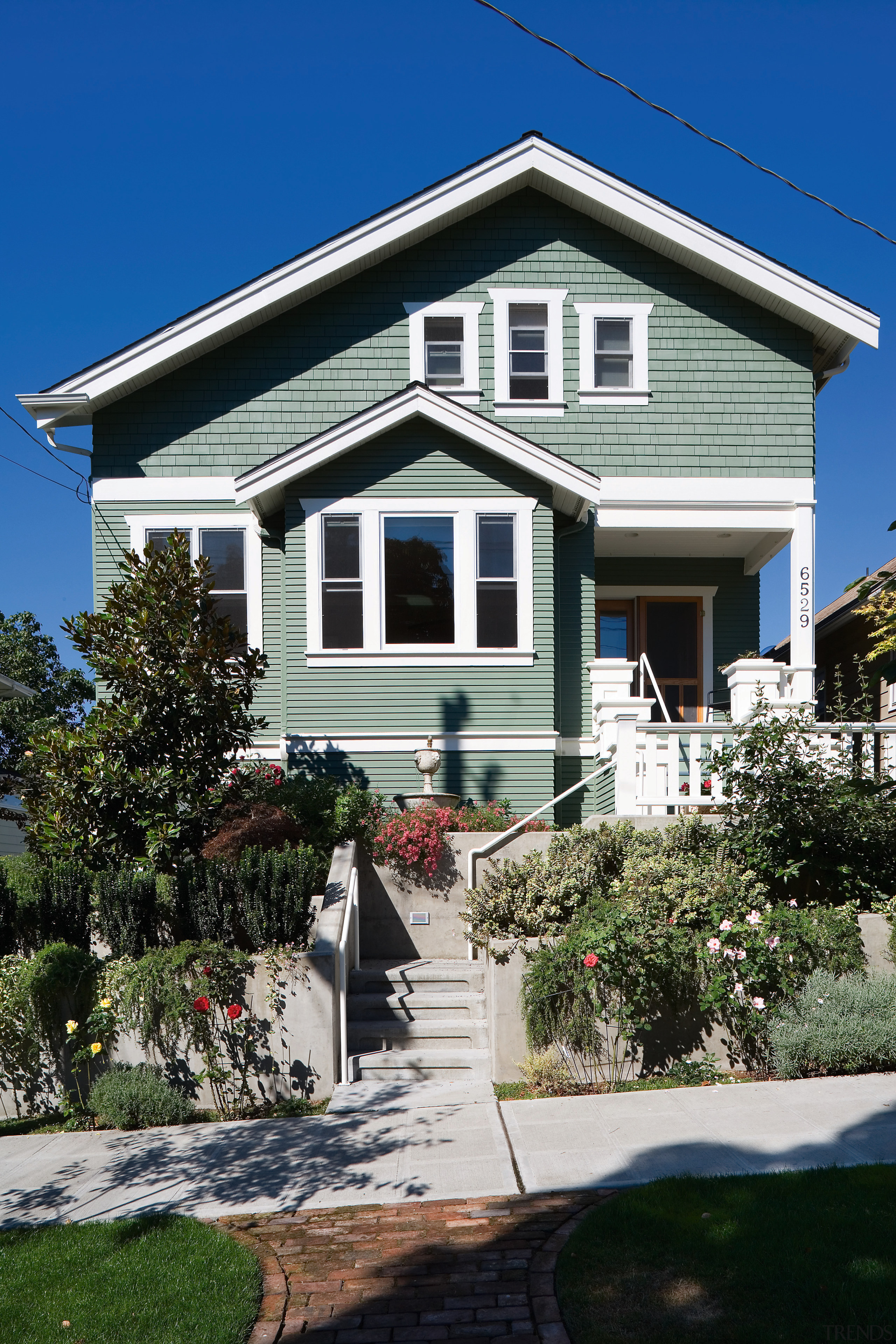 An exterior view of the home. - An building, cottage, elevation, estate, facade, home, house, neighbourhood, property, real estate, residential area, siding, sky, villa, window, black