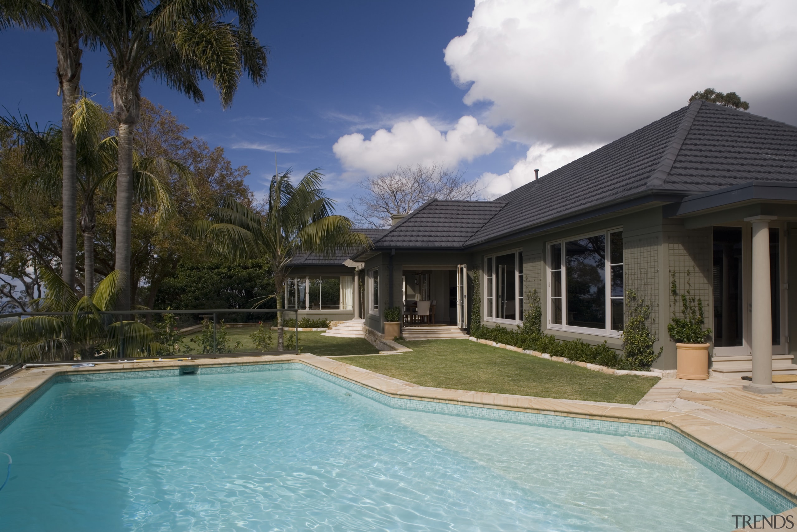 Due to a disjointed floor plan, the new backyard, cottage, estate, facade, home, house, leisure, mansion, property, real estate, residential area, resort, roof, sky, swimming pool, villa, water, window, black