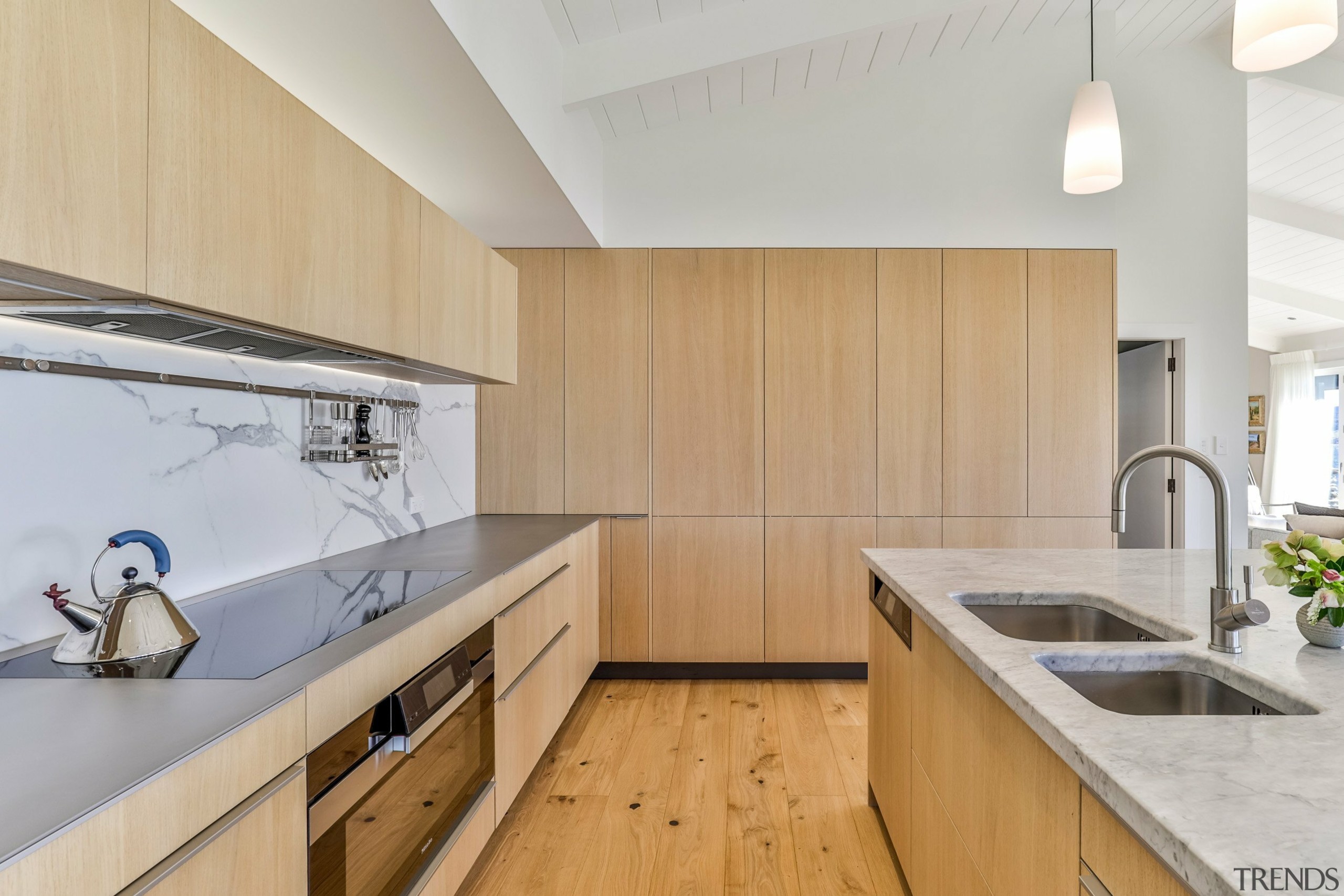 Porcelain splashbacks were selected to complement the natural 