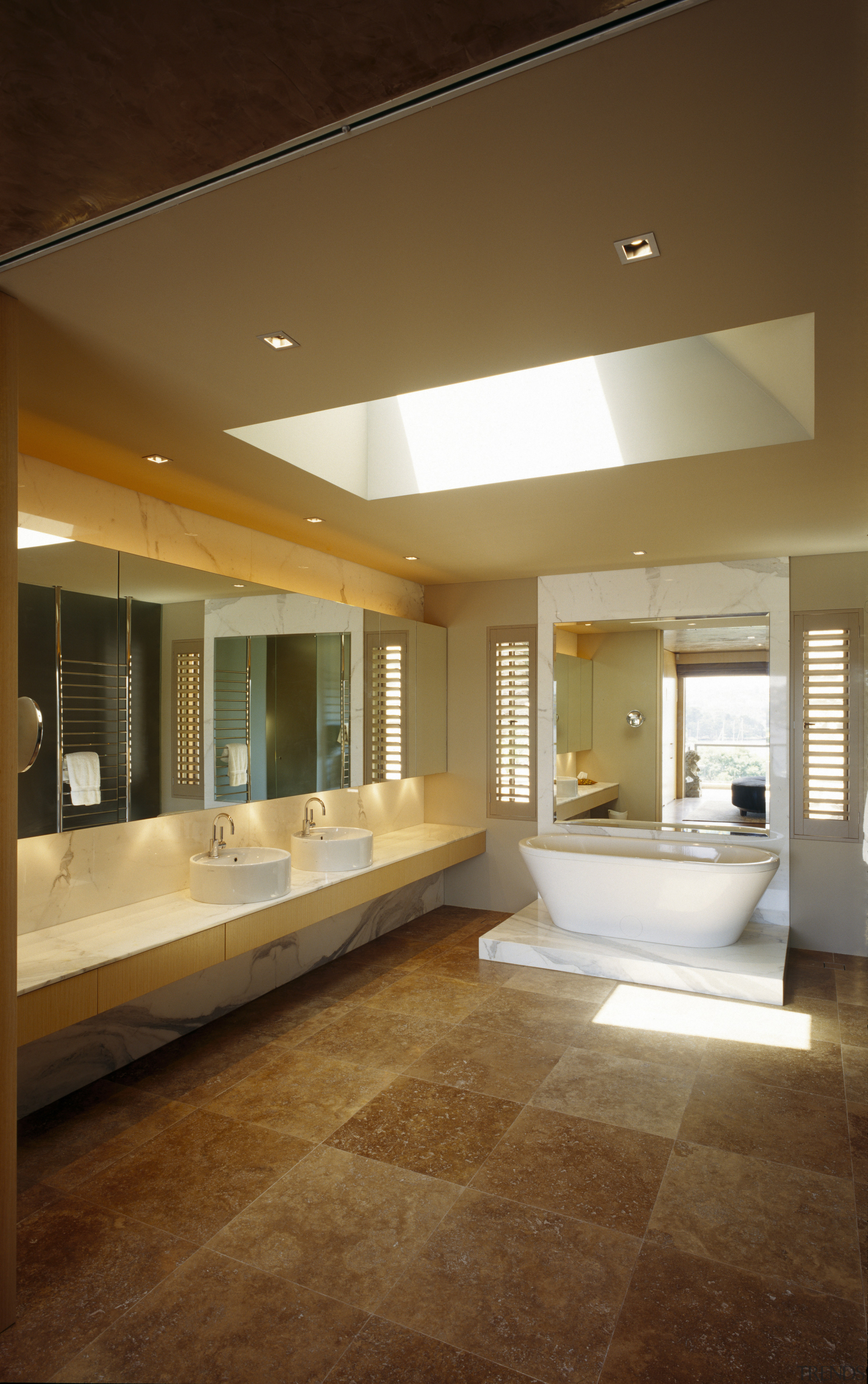 view of ensuite featuring travertine flooring, freestanding bath architecture, bathroom, ceiling, daylighting, estate, floor, flooring, hardwood, home, house, interior design, lighting, living room, lobby, real estate, room, tile, window, wood flooring, brown