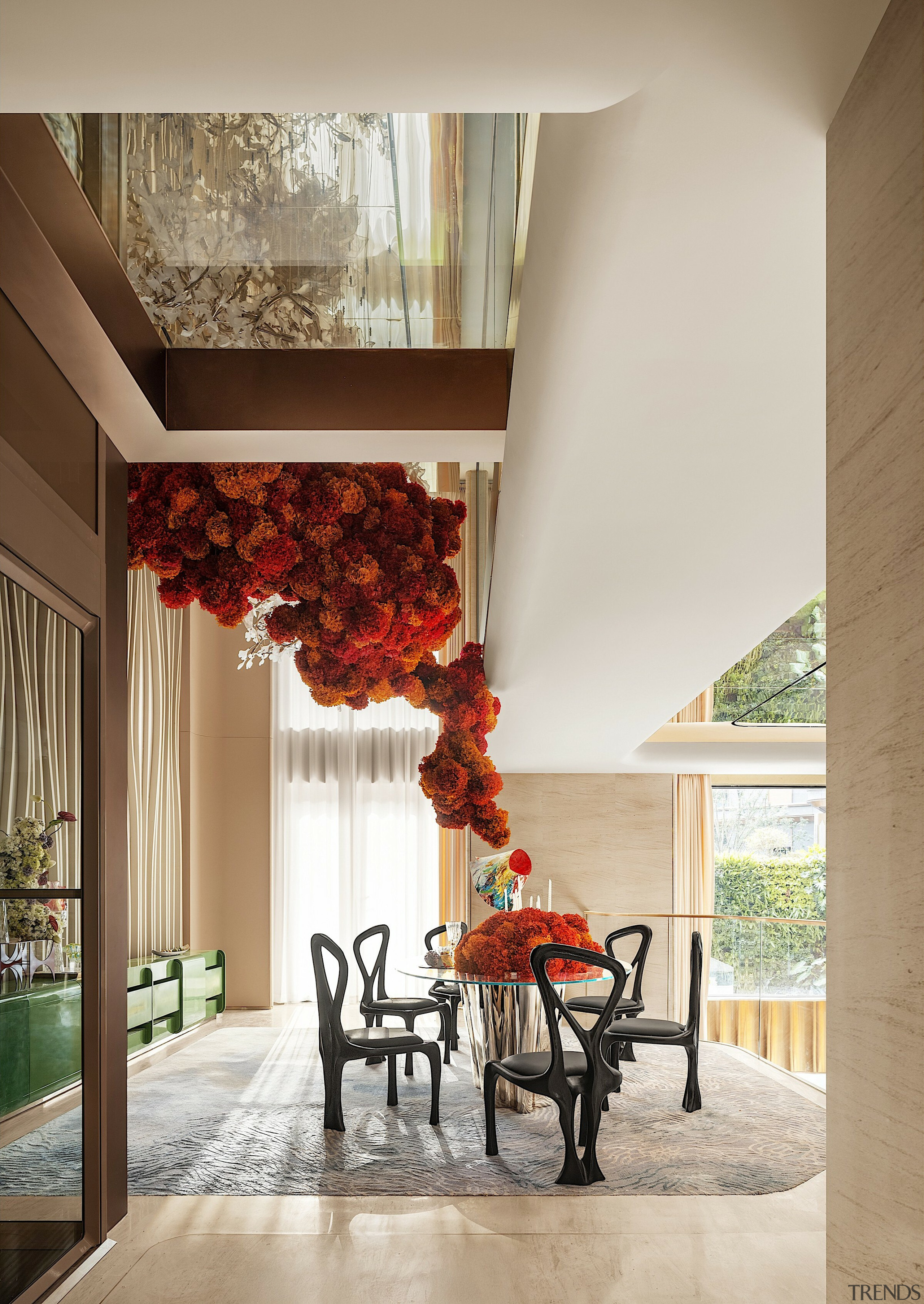 Dining area showing soaring upstairs volume. 
