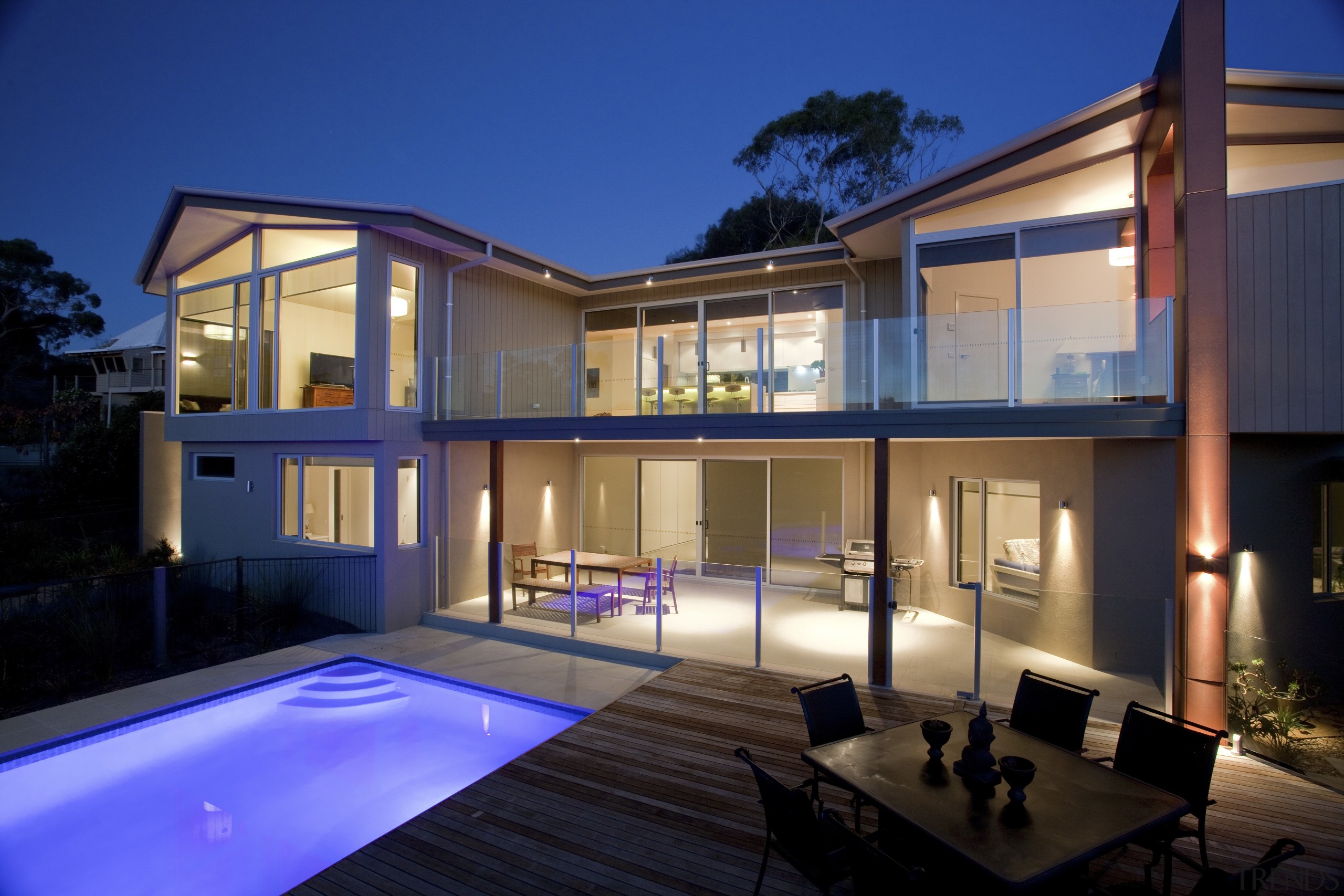 This home was designed and built by Graeme apartment, architecture, elevation, estate, facade, home, house, lighting, property, real estate, residential area, swimming pool, villa, window, blue