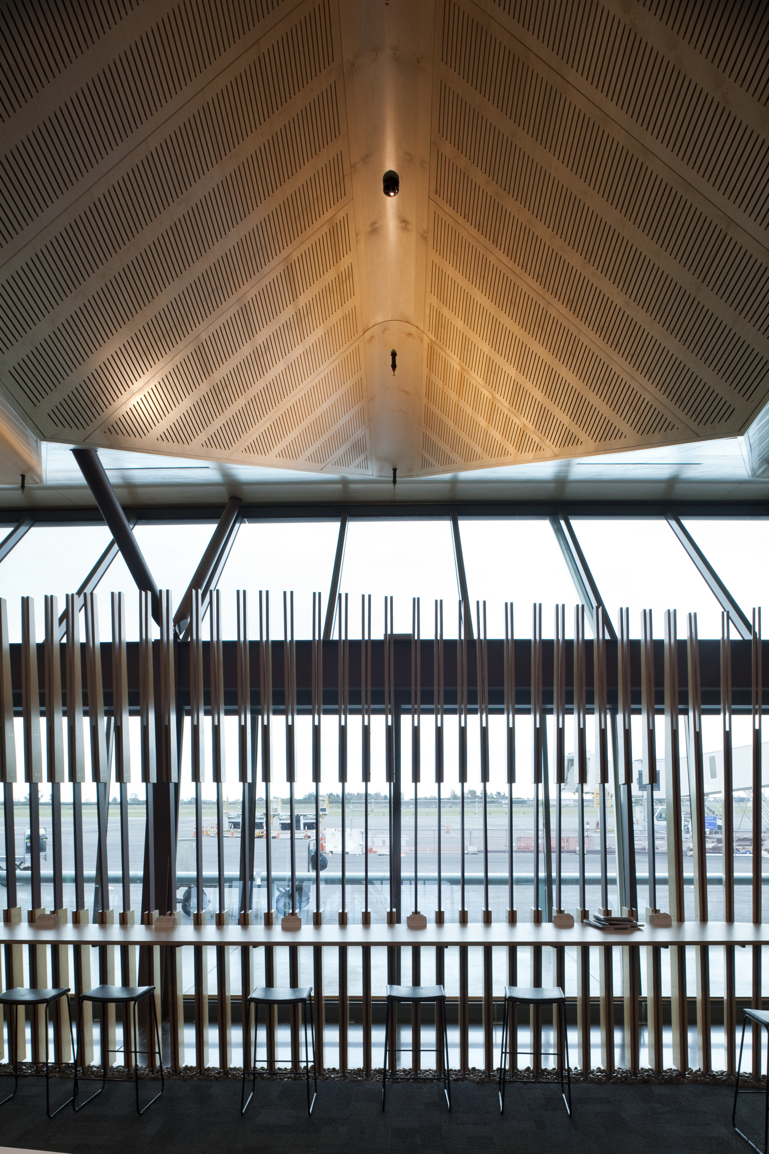 View of the interior of Christchurch Airport. Organic architecture, baluster, ceiling, daylighting, handrail, light, lighting, line, structure, symmetry, window, black