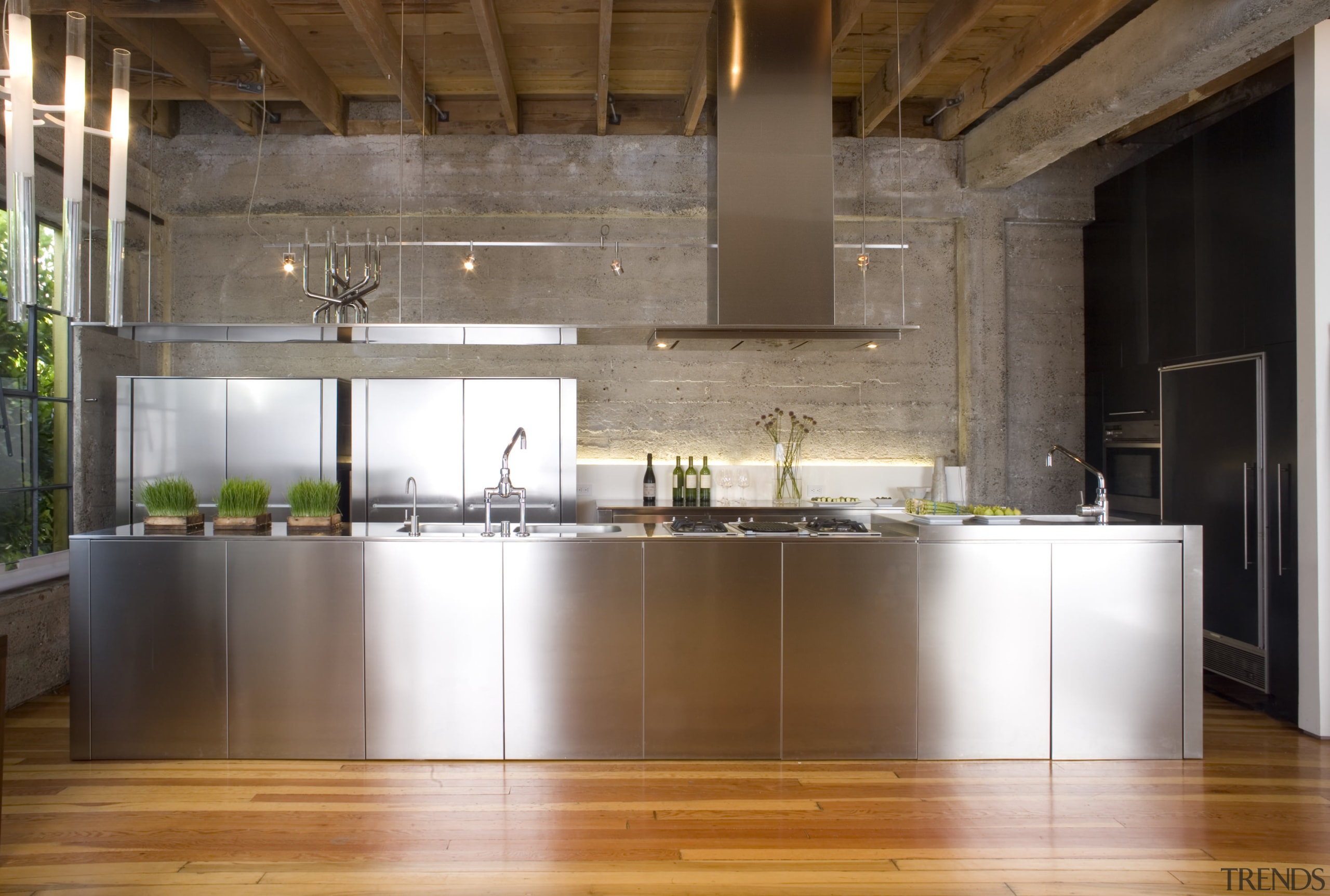 View of a kitchen which features stainless steel ceiling, countertop, cuisine classique, floor, flooring, interior design, kitchen, loft, real estate, wood flooring, brown