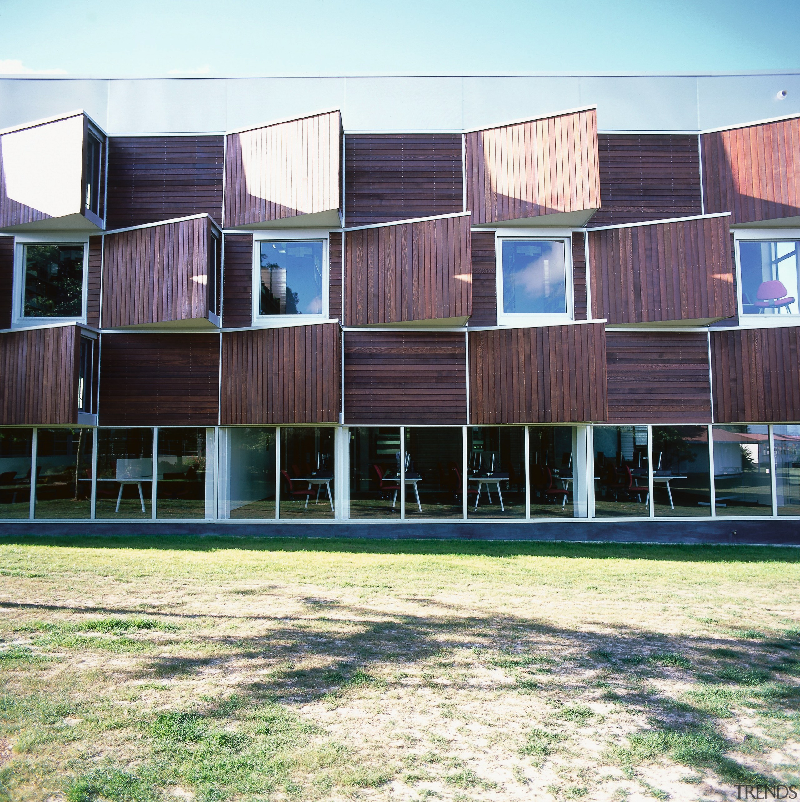 An exterior view of the library. - An architecture, building, facade, house, real estate, residential area, siding, window, wood, white