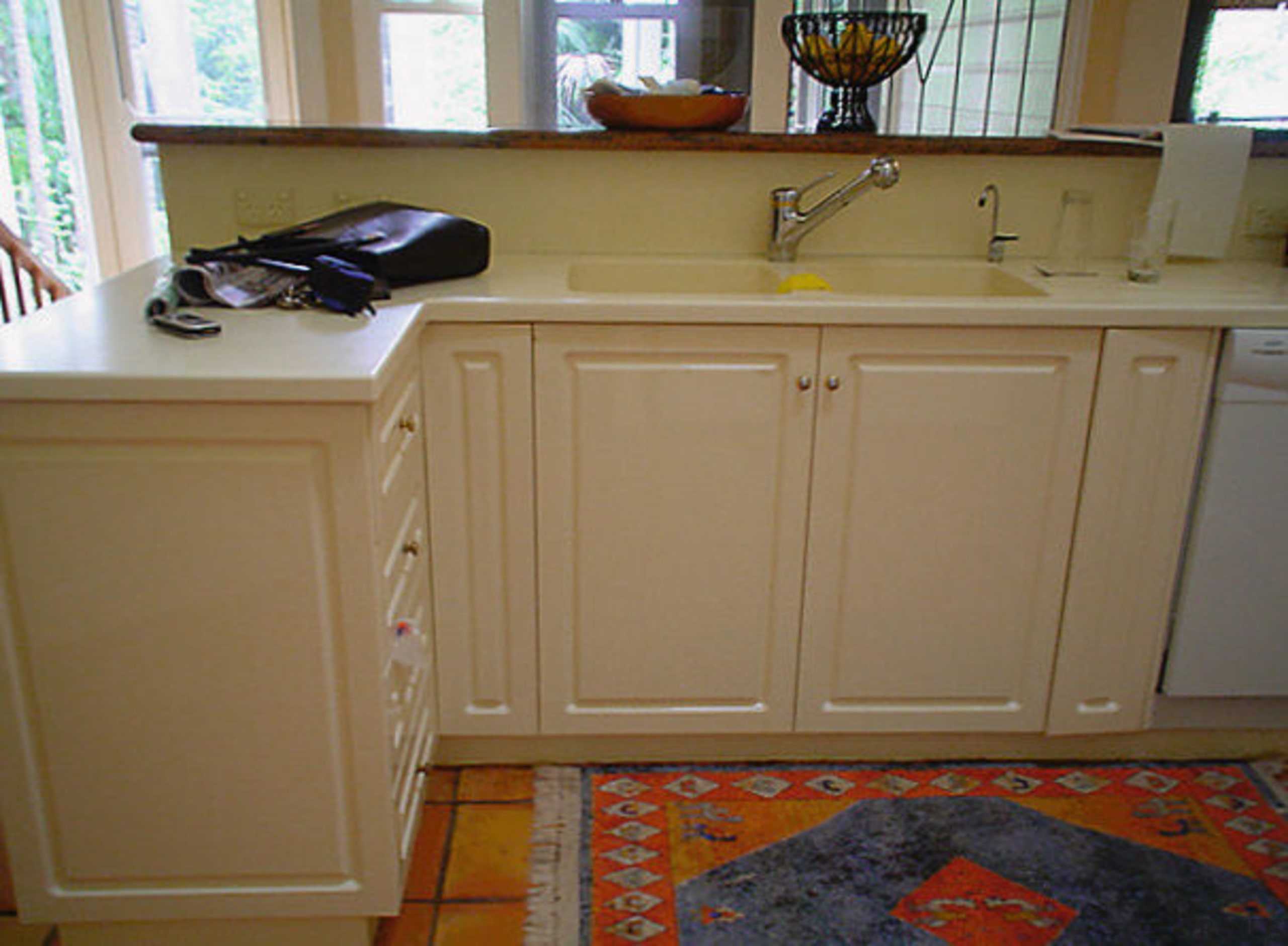 View of the kitchen before it was was cabinetry, chest of drawers, countertop, cupboard, drawer, floor, flooring, furniture, hardwood, kitchen, room, wood, wood stain, brown