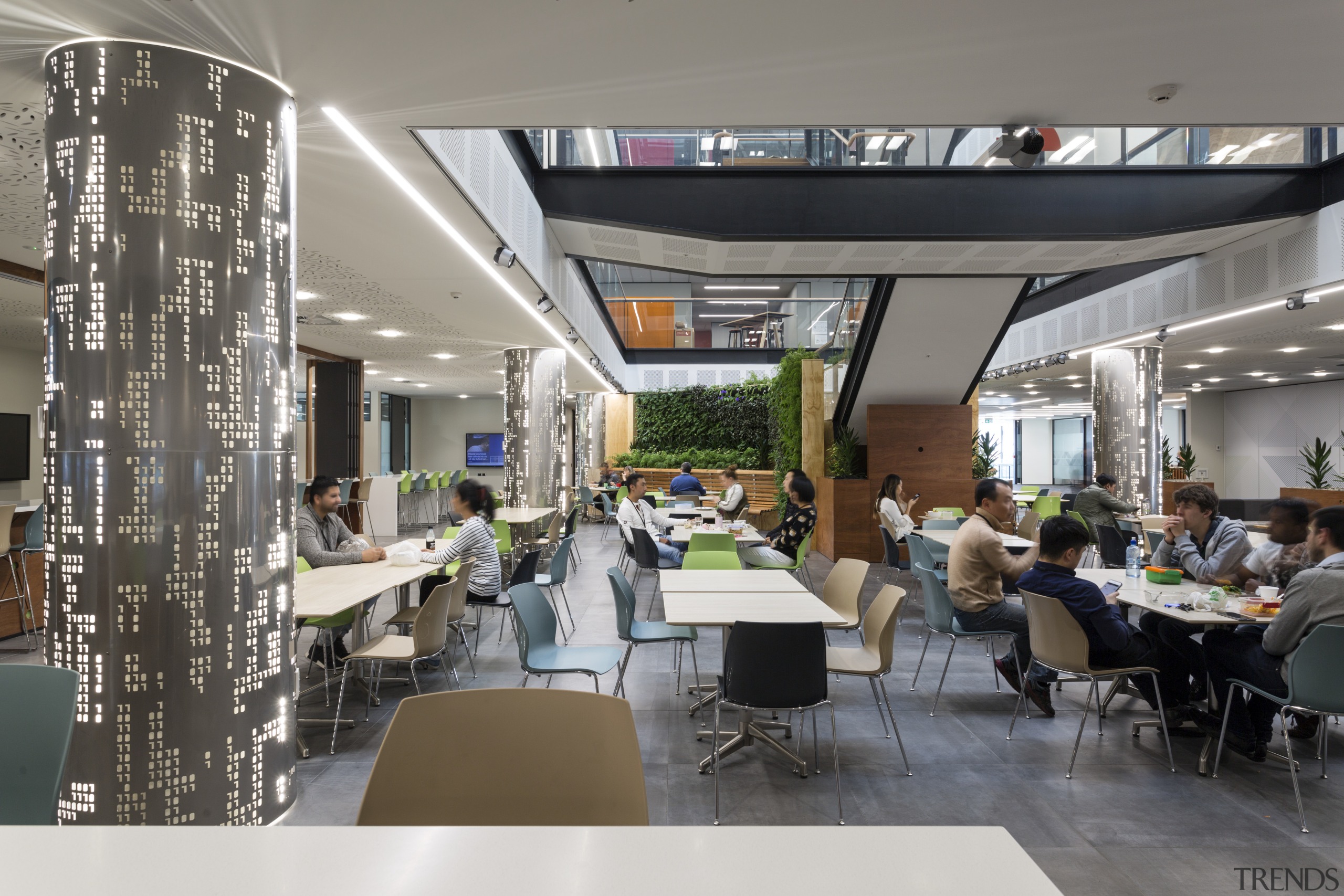 The soaring light-filled atrium of the Datacom building interior design, restaurant, gray