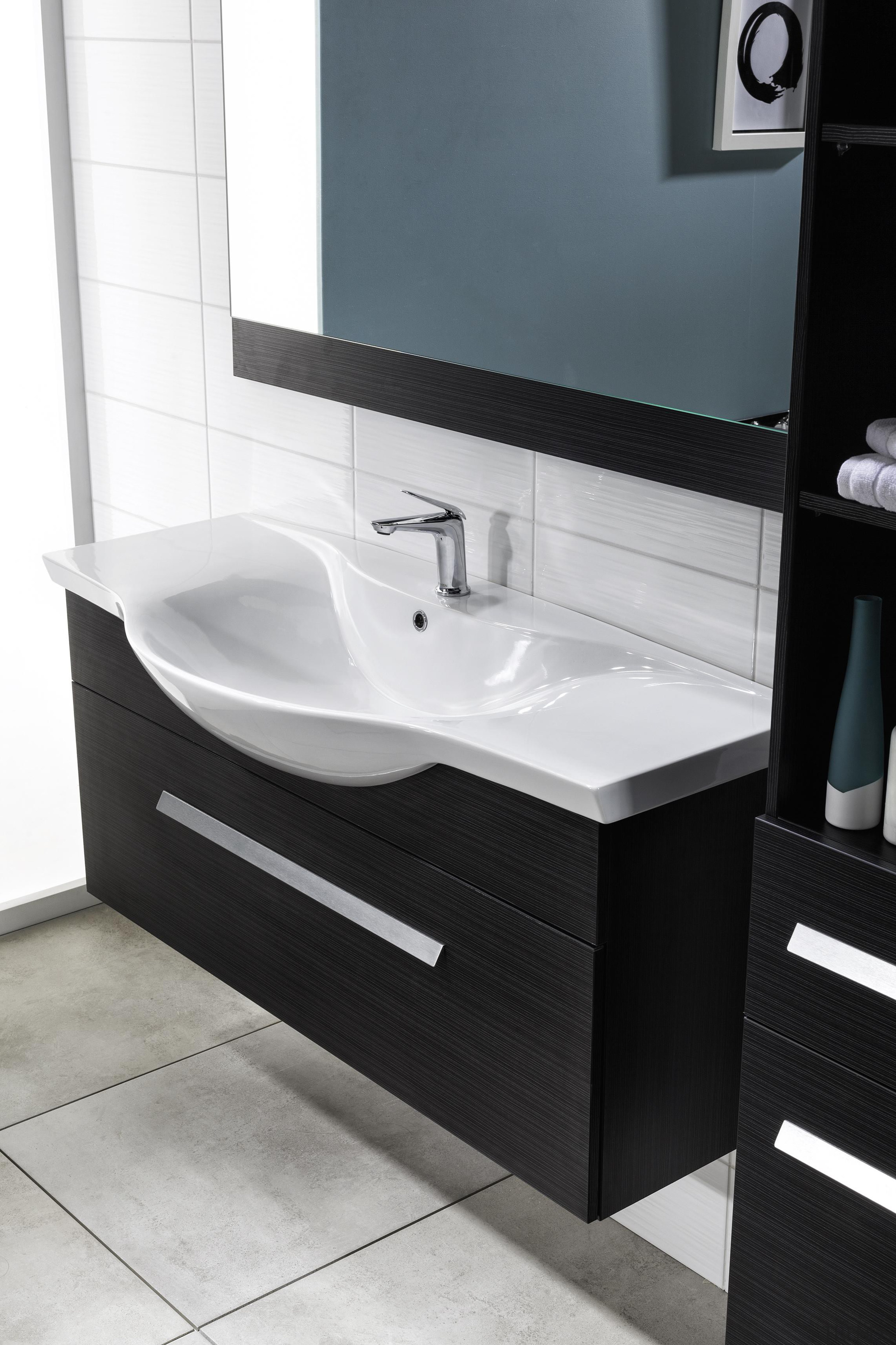A classic style is formed when sweeping edges angle, bathroom, bathroom accessory, bathroom cabinet, bathroom sink, plumbing fixture, product, product design, sink, tap, white, black