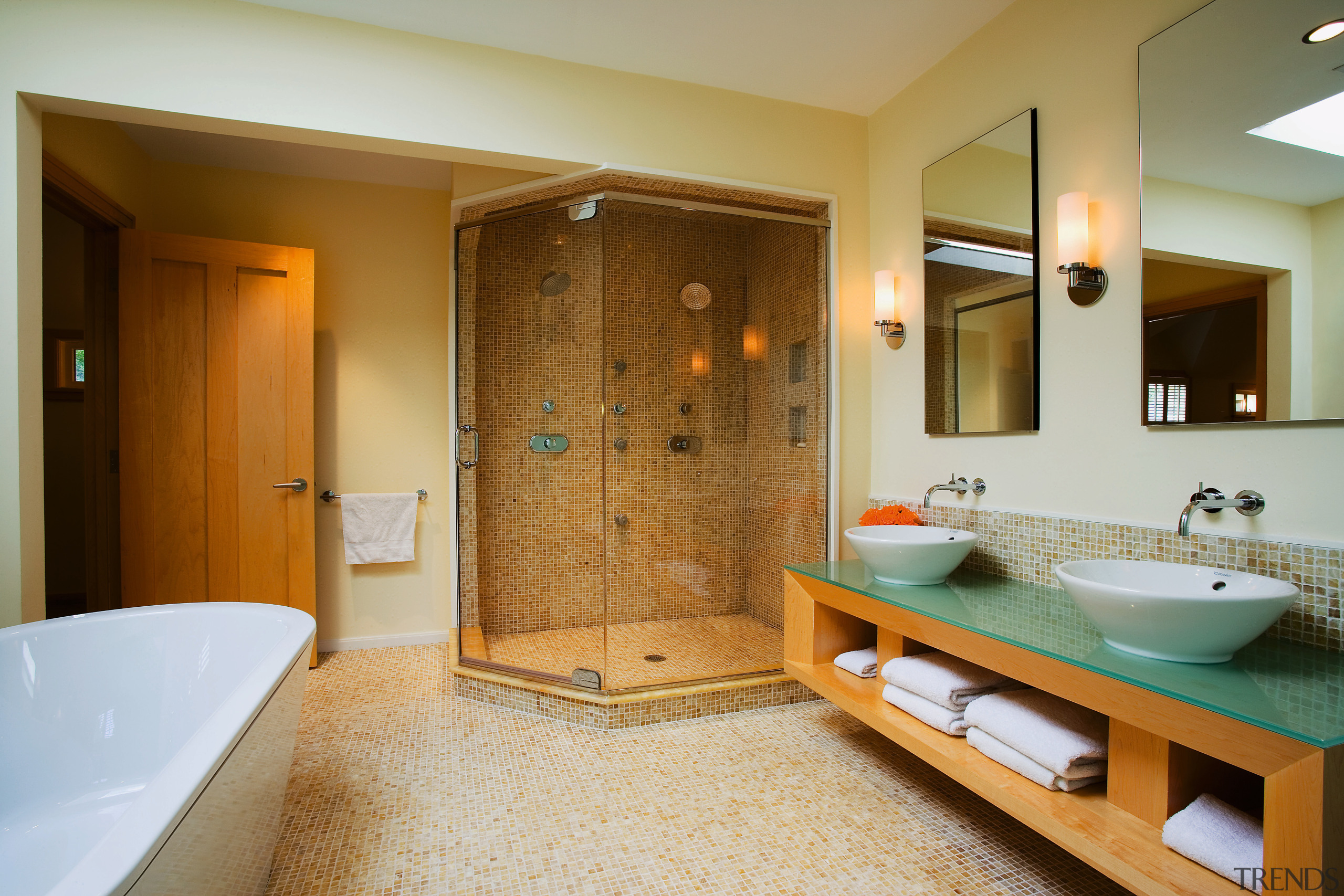 A view of the Bathroom featuring tiled flooring/walls, bathroom, estate, home, interior design, real estate, room, suite, brown