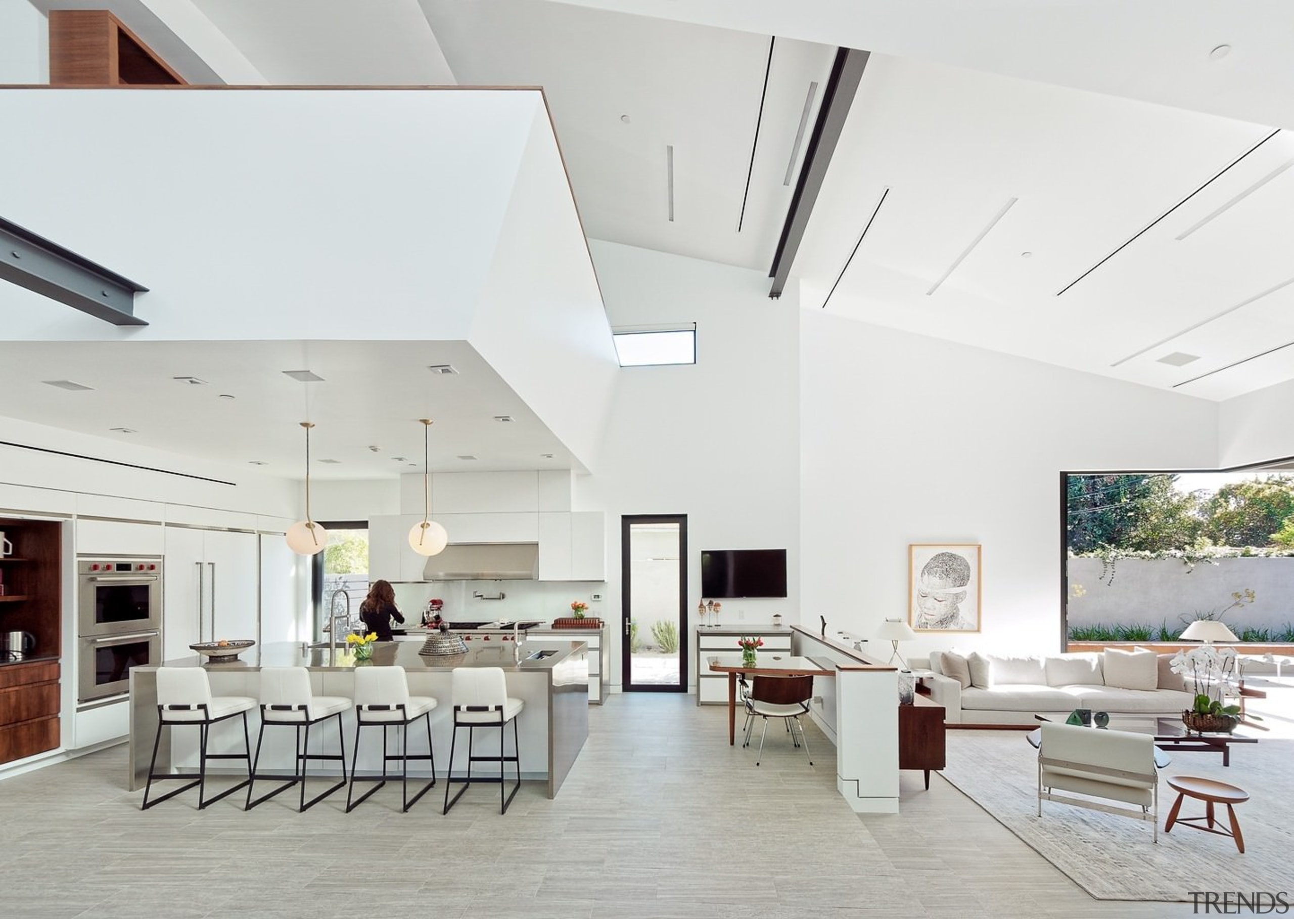 The cavernous living area wraps around a large architecture, ceiling, daylighting, house, interior design, living room, real estate, white