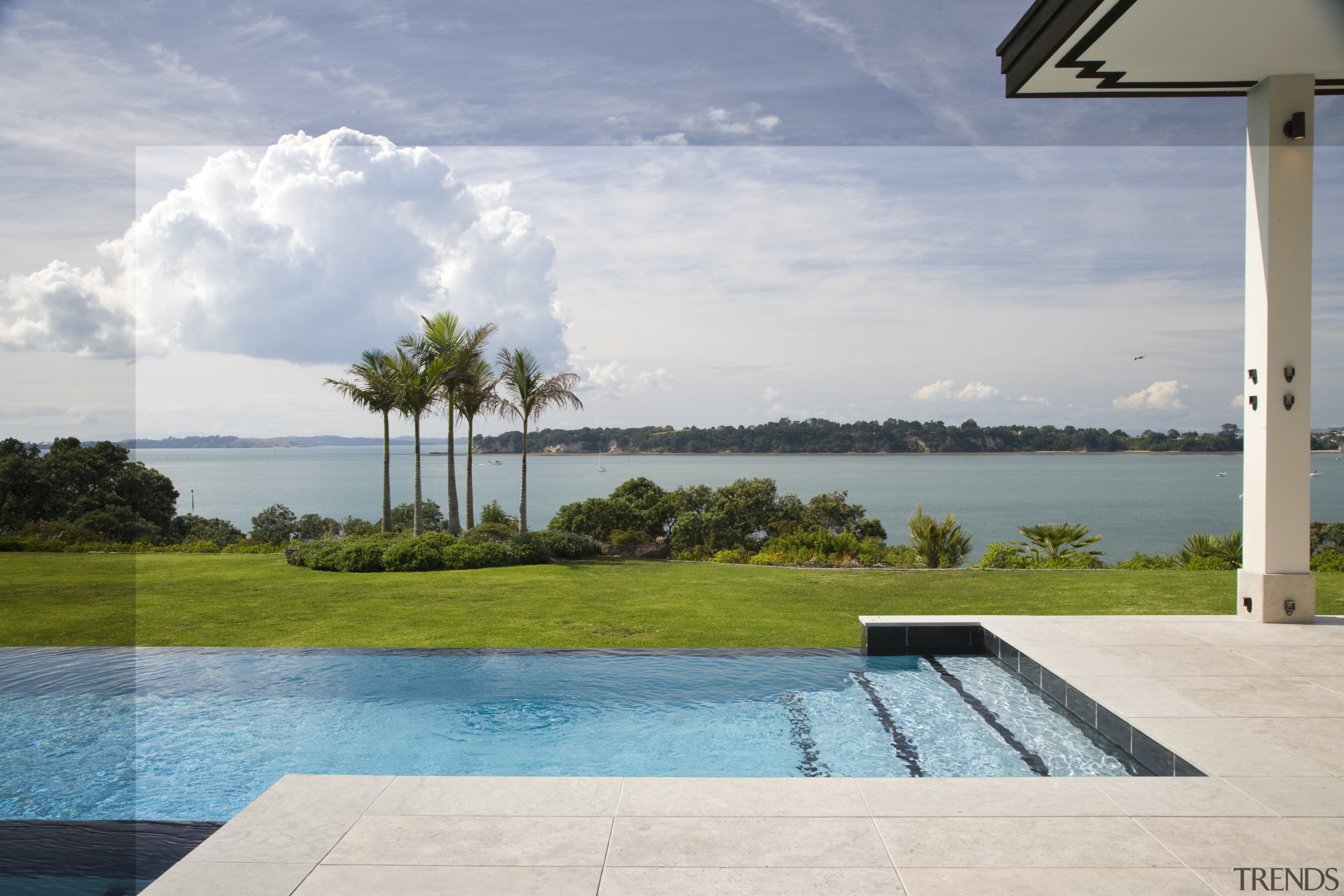 The garden slopes steeply to the coast. - arecales, cloud, estate, house, palm tree, property, real estate, resort, sea, sky, swimming pool, vacation, villa, water, gray