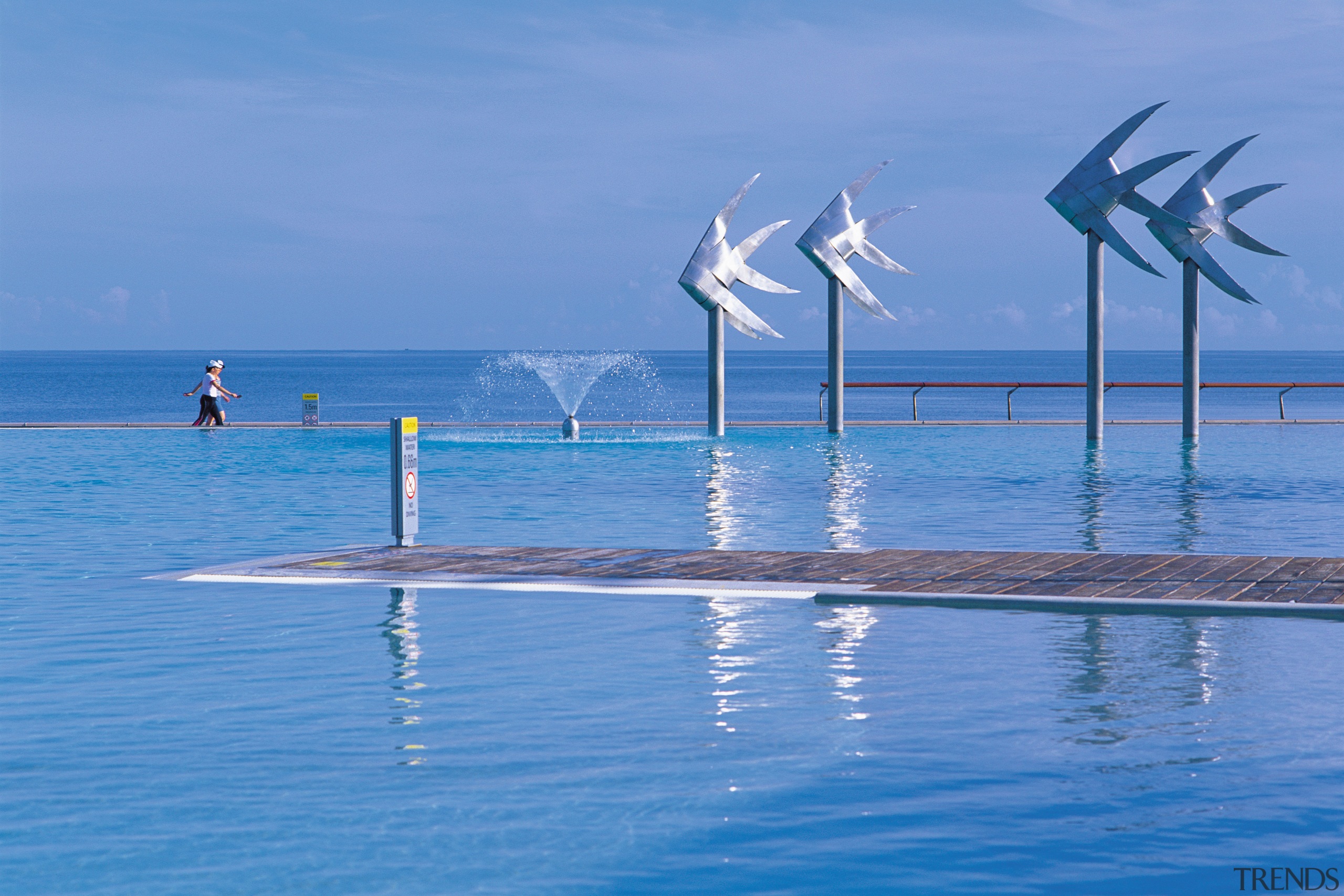 A view of the esplanade lagoon area, 4 calm, coastal and oceanic landforms, energy, ocean, sea, shore, sky, vacation, water, wave, wind, wind farm, wind turbine, teal