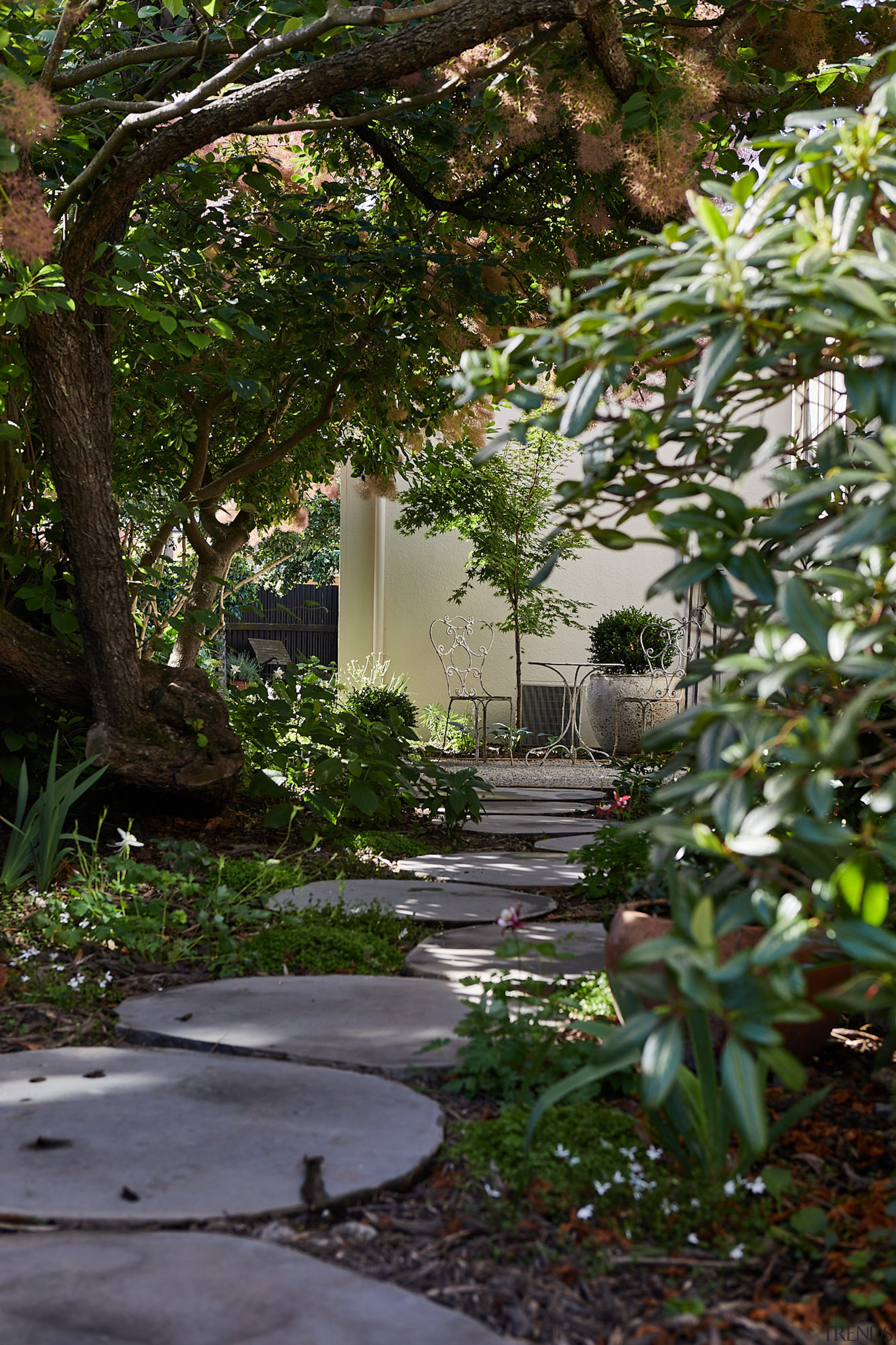 Pavers leading to an al fresco seating area 