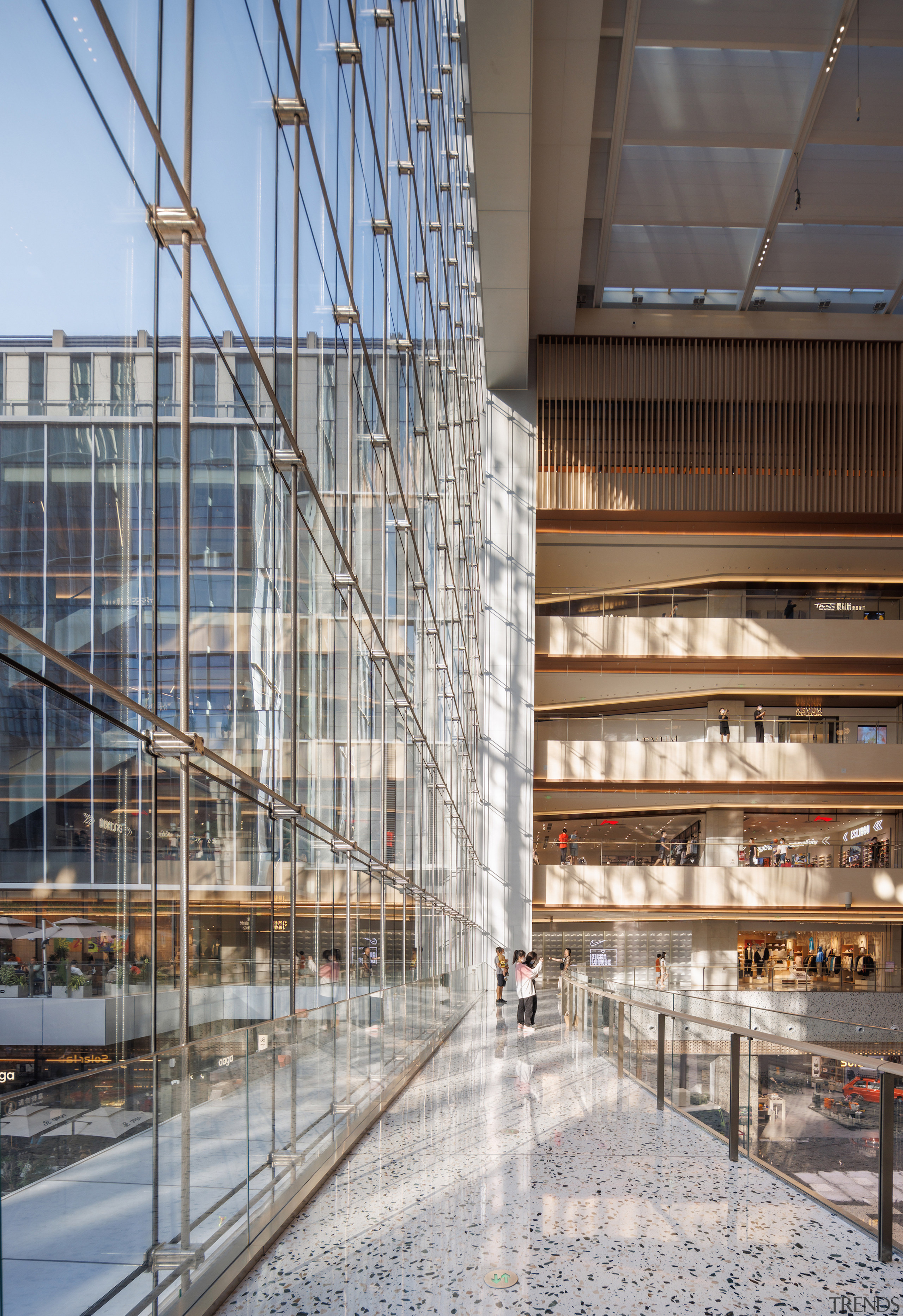 Glass curtain wall. - Floating 'food trucks' evoke 