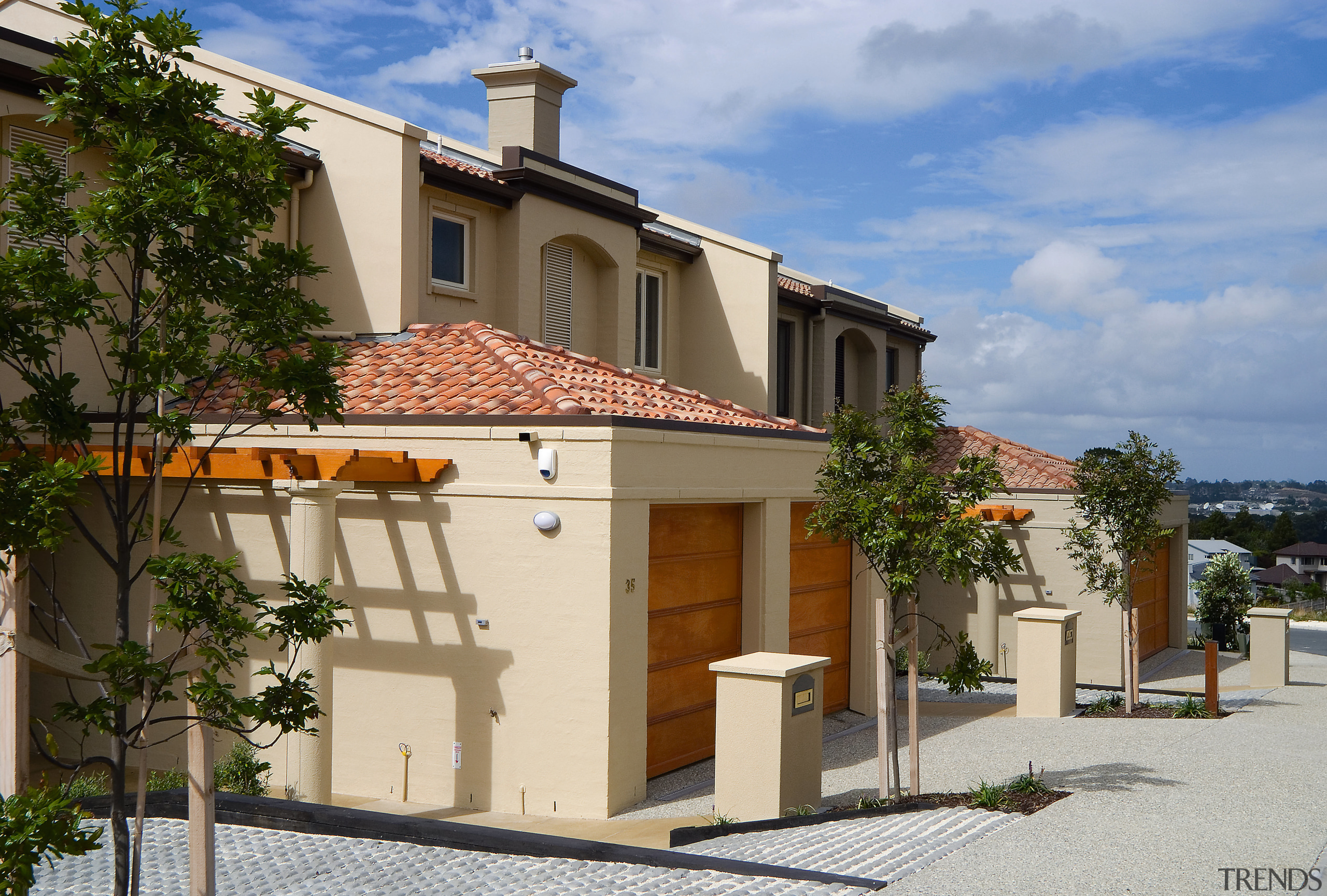 A view of the Point Ridge development. - building, cottage, facade, home, house, property, real estate, residential area, roof, villa, brown, teal