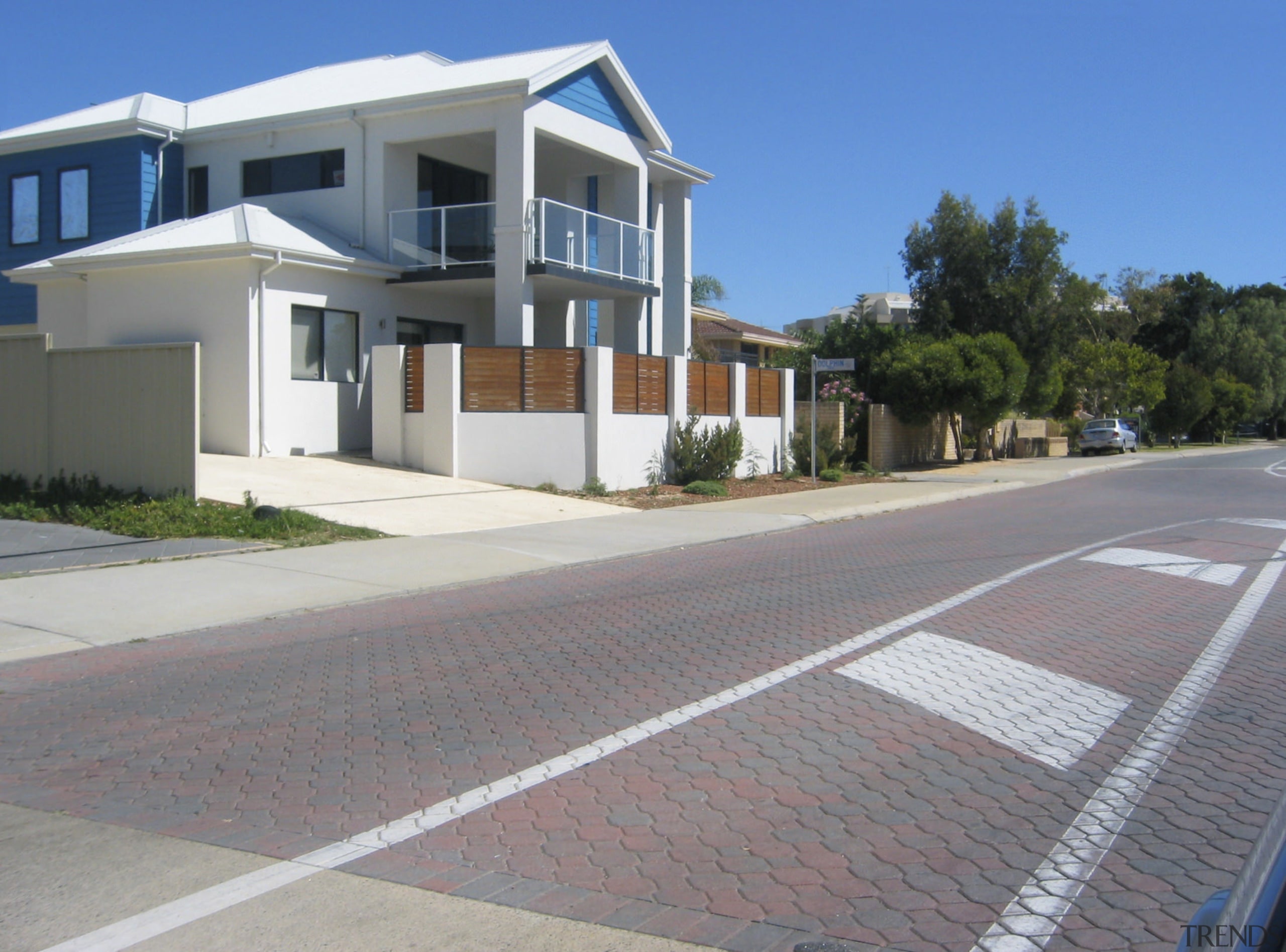 View of the Carnarvon doreshore in Gascoyne which apartment, area, asphalt, building, estate, facade, home, house, neighbourhood, property, real estate, residential area, road surface, sky, suburb, gray