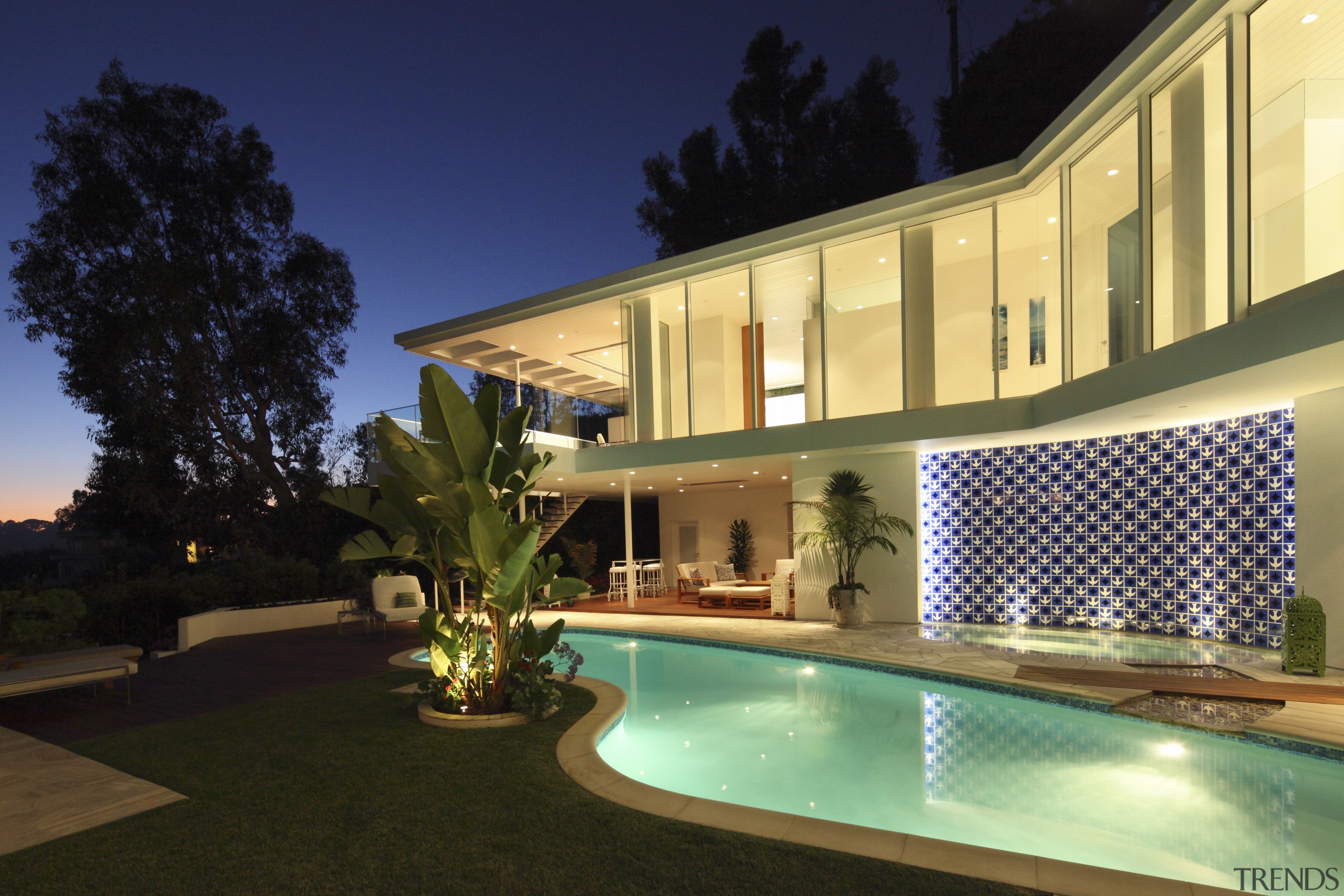 New wing added on to 1950s residence as apartment, architecture, backyard, estate, home, hotel, house, landscape lighting, lighting, property, real estate, residential area, resort, swimming pool, villa, window