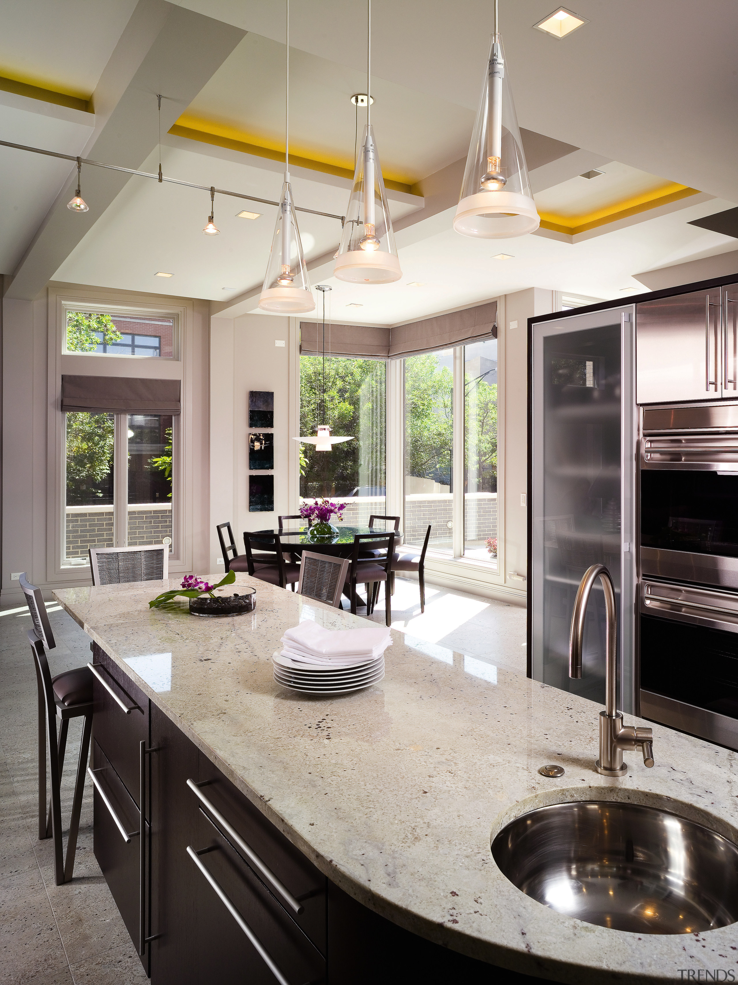 A view of this kitchen featuring dark brown countertop, cuisine classique, interior design, kitchen, gray