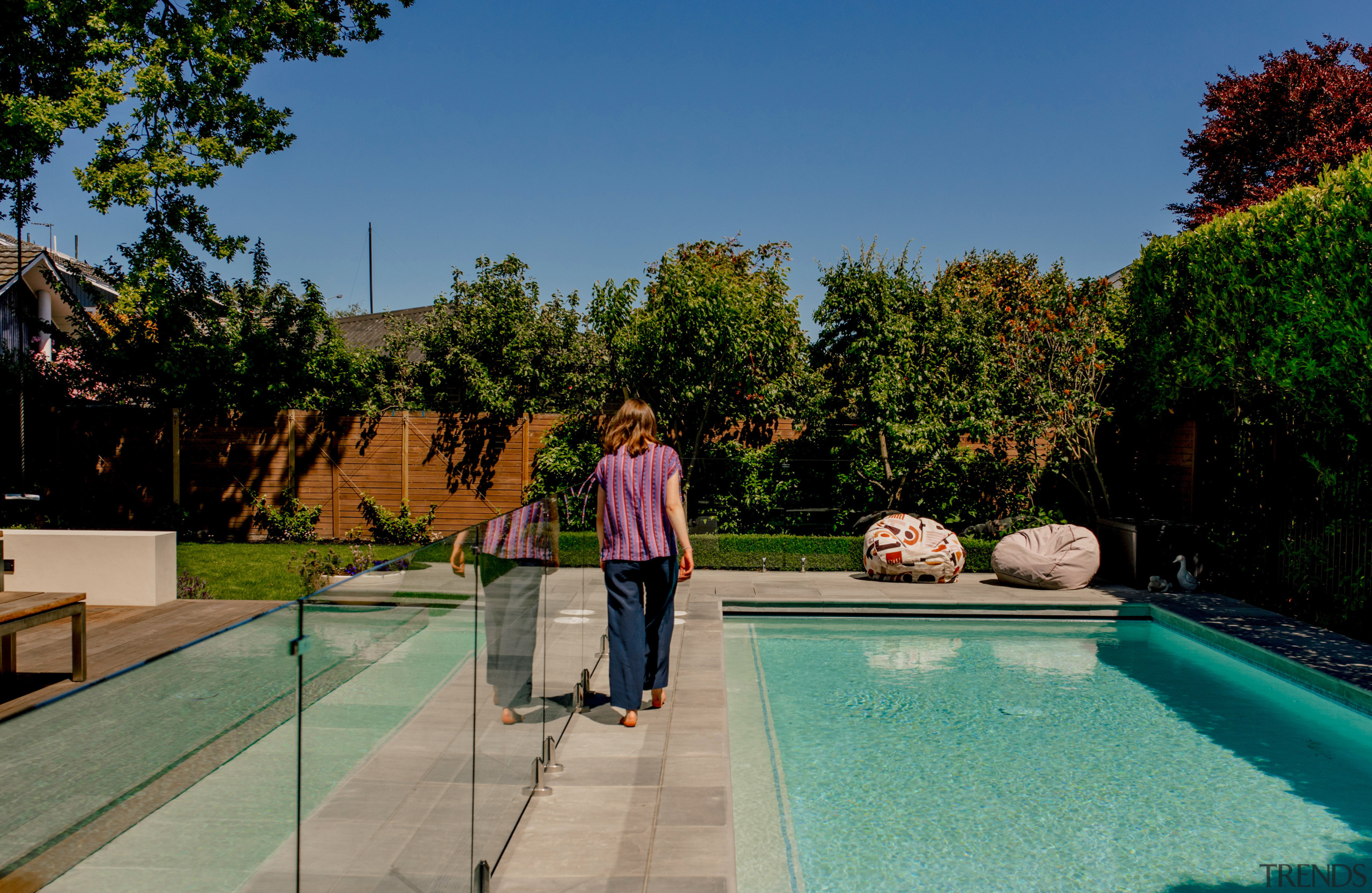 Surrounding the pool with plantings on two sides 
