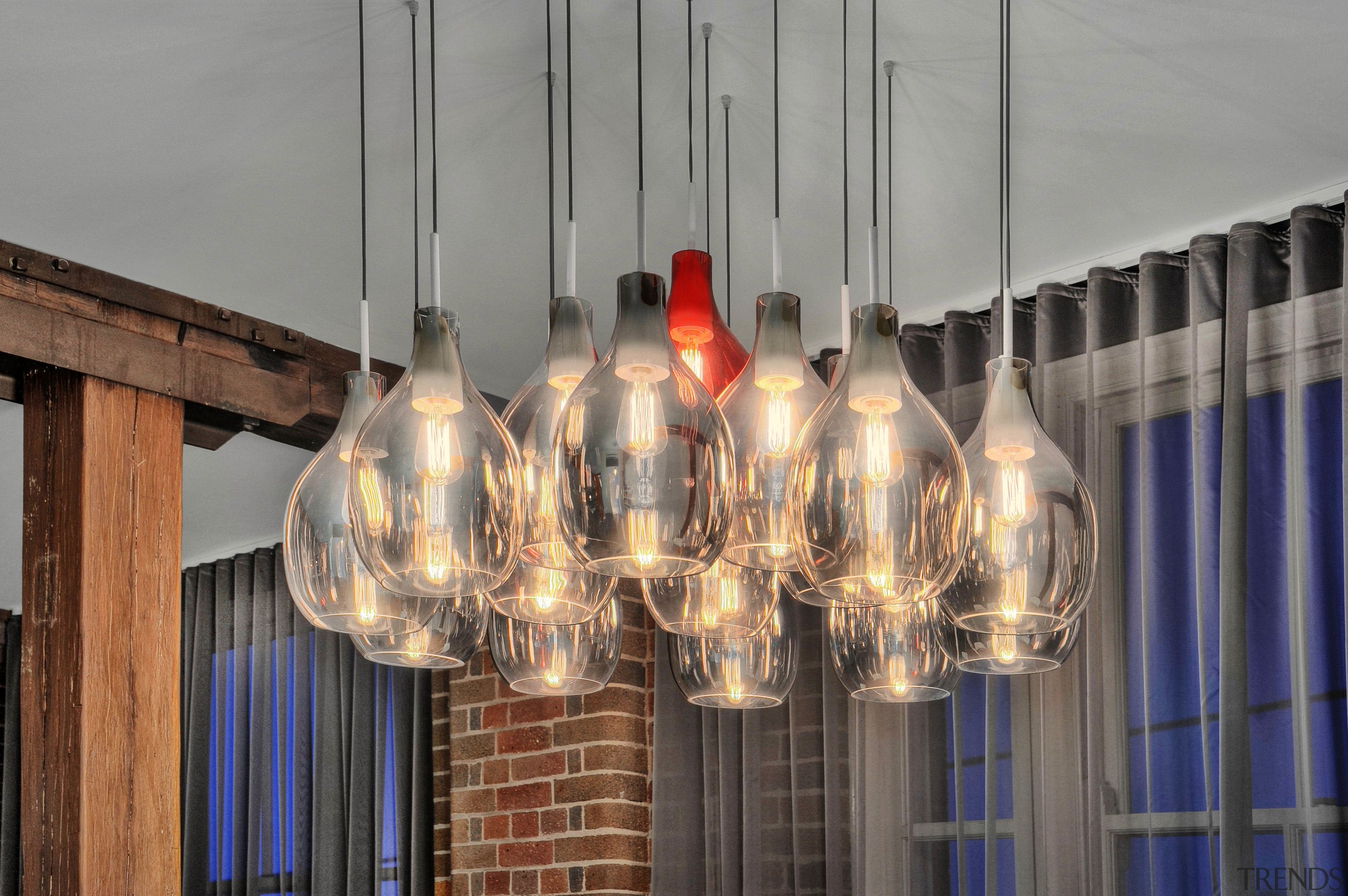 The hand-blown glass pendant light is a feature chandelier, light fixture, lighting, gray