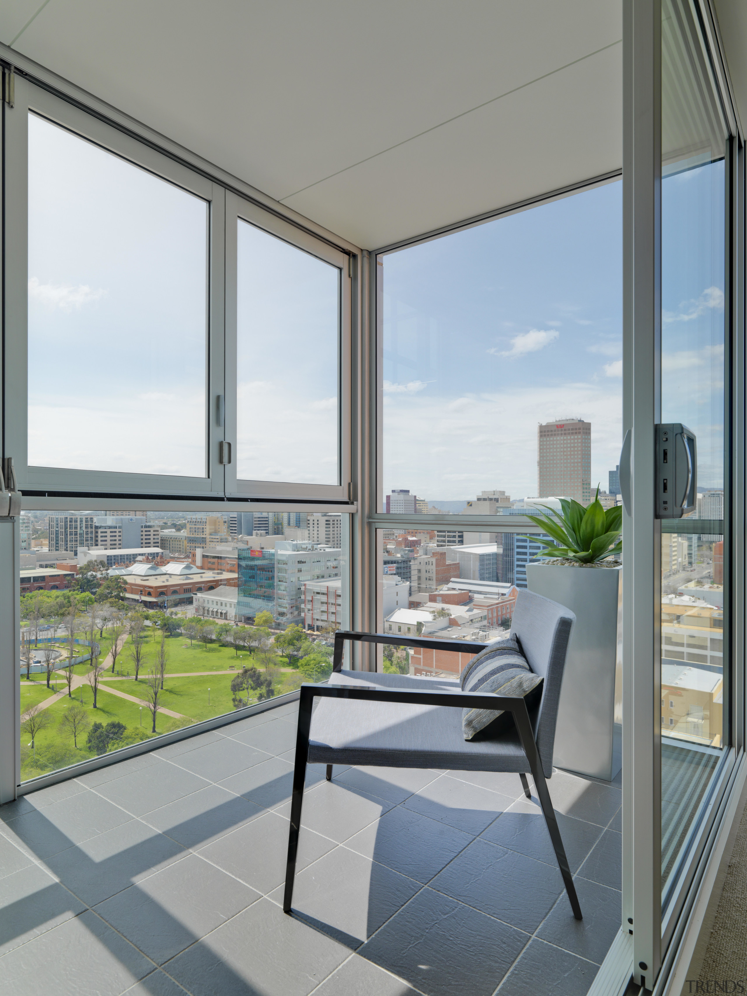 View of covered balcony of an apartment at apartment, architecture, balcony, condominium, daylighting, glass, house, interior design, real estate, shade, window, gray