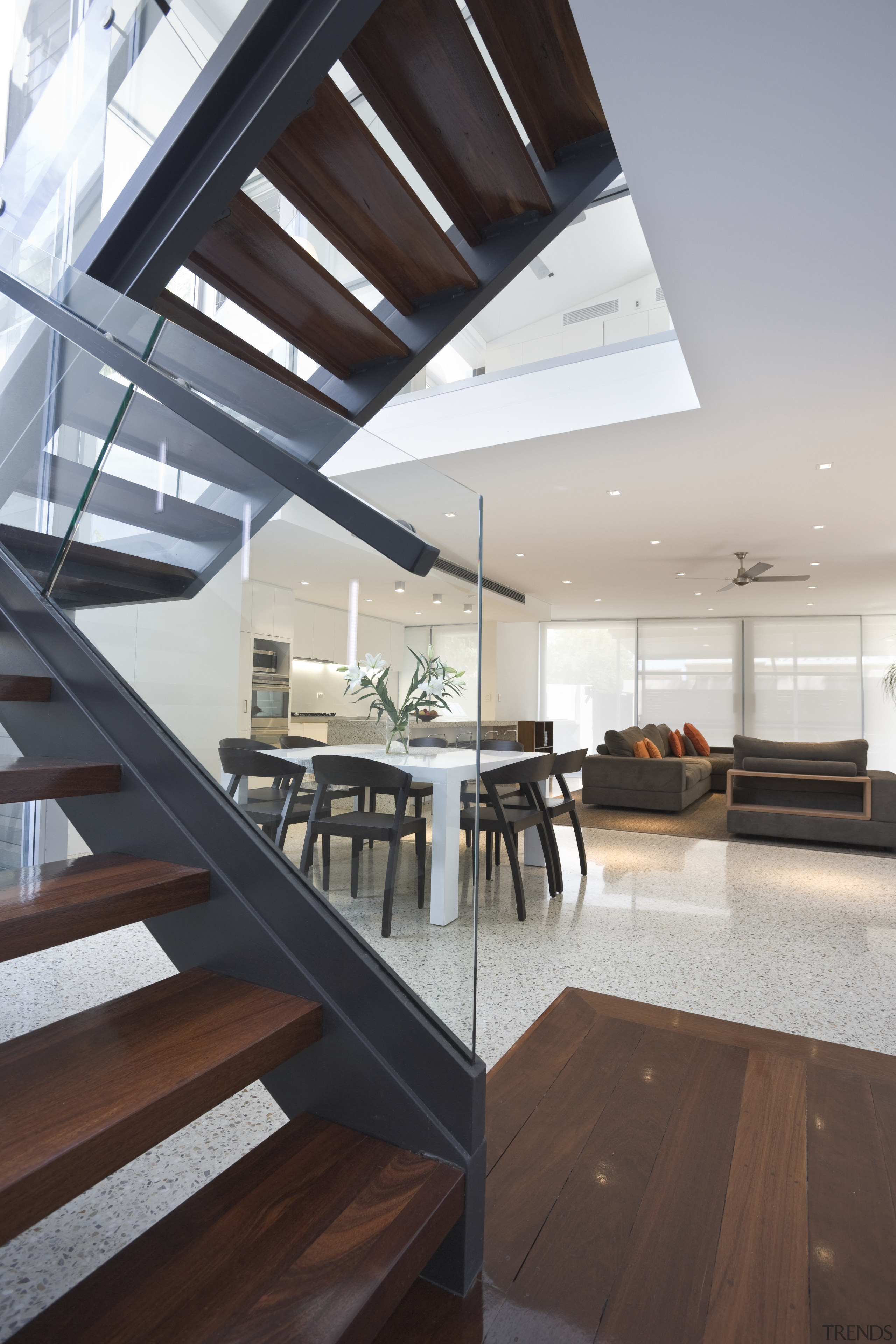 Modern stairway situated by dining &amp; living area apartment, architecture, ceiling, daylighting, floor, handrail, house, interior design, penthouse apartment, real estate, gray, black