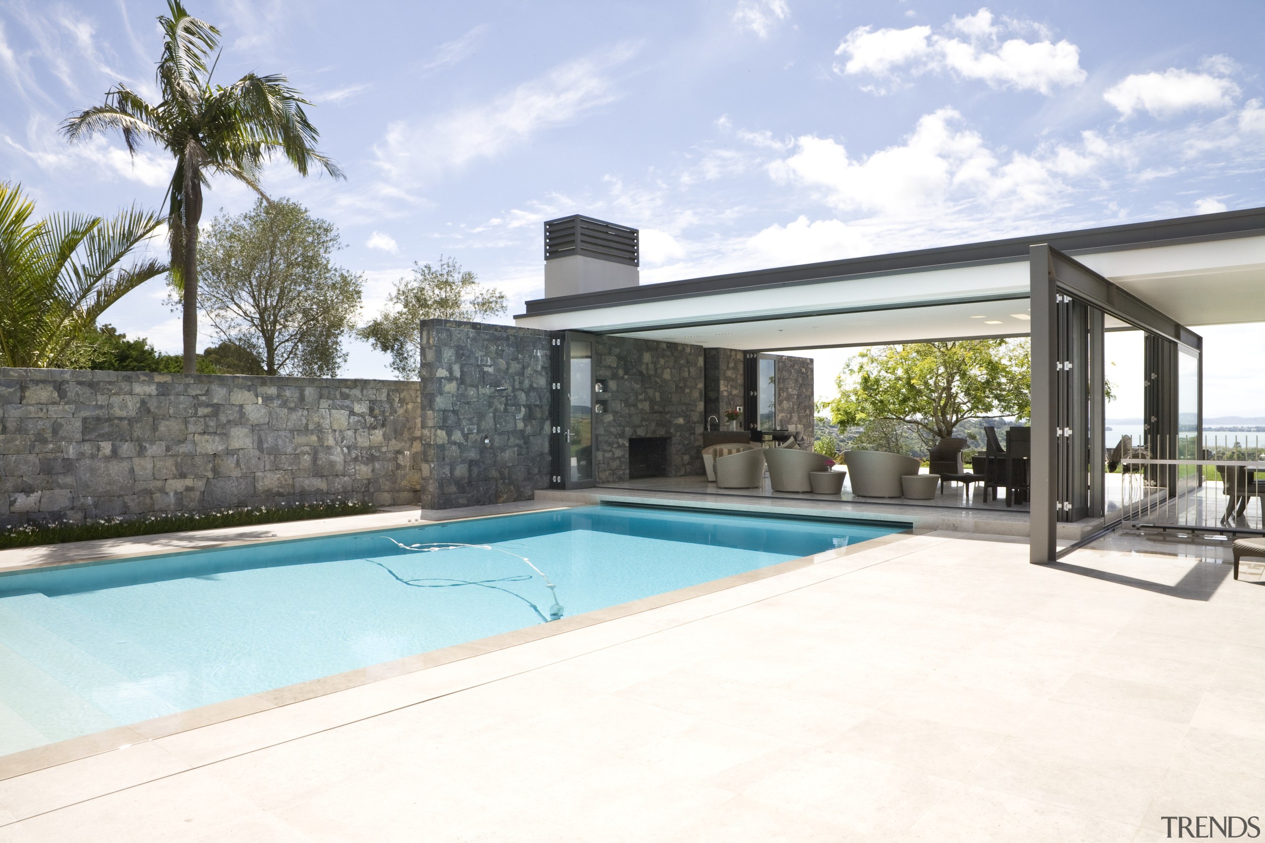 Image of stone walls which have been built estate, home, house, property, real estate, swimming pool, villa, white, teal
