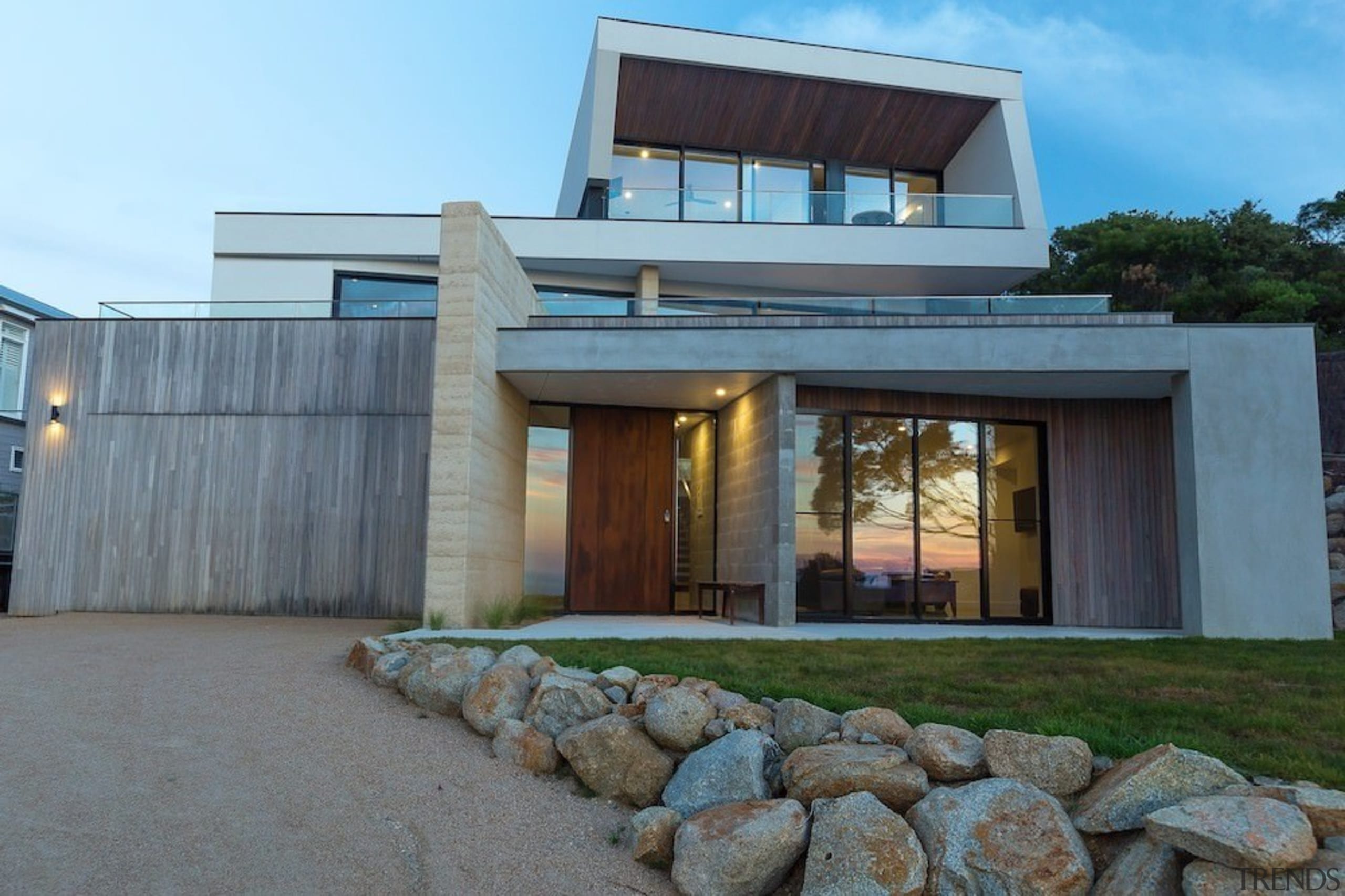 It's a home of layers - It's a architecture, building, facade, home, house, property, real estate, teal, gray