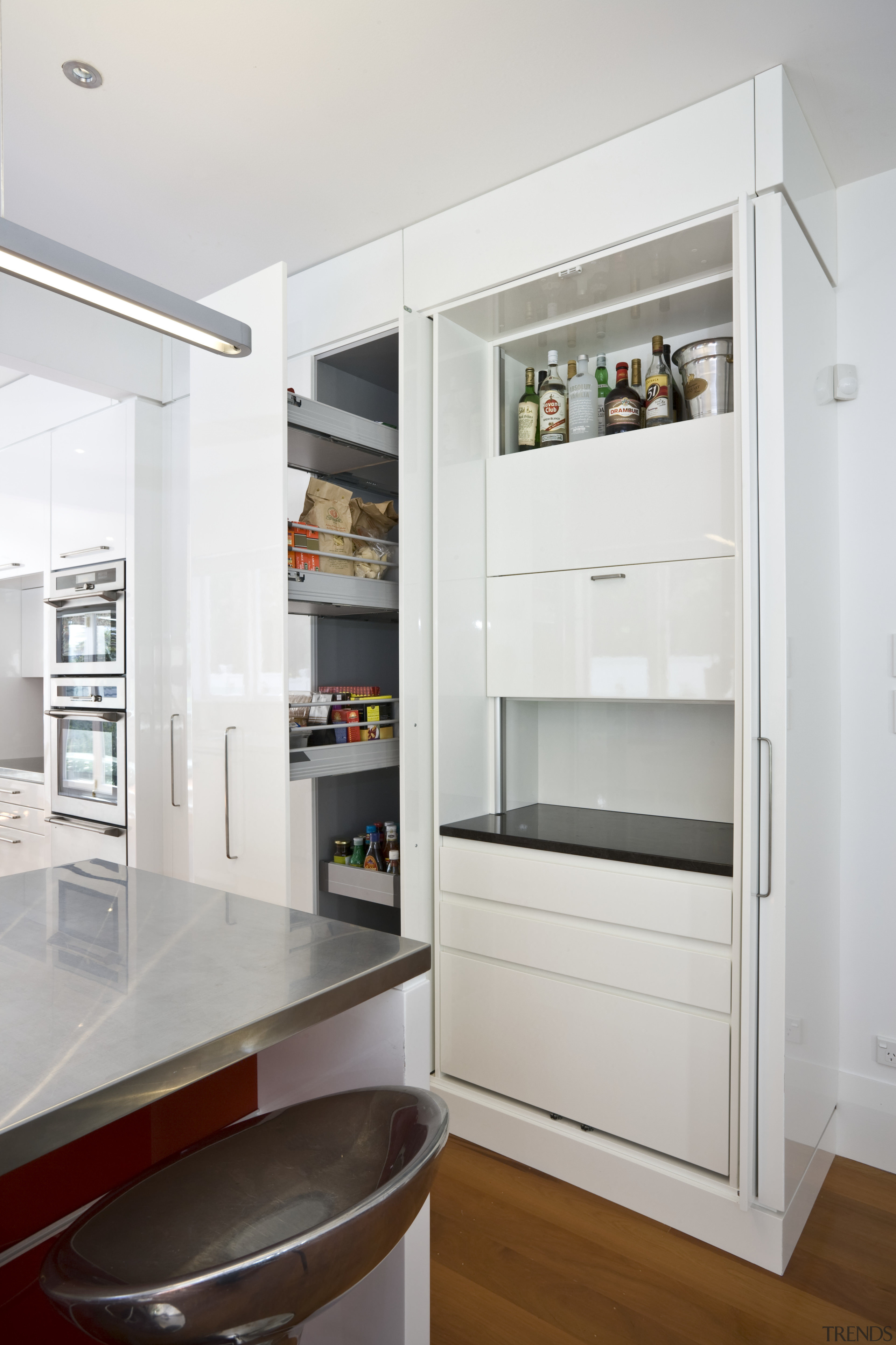 view of a kitchen designed and manufactured by cabinetry, countertop, home appliance, interior design, kitchen, kitchen appliance, major appliance, refrigerator, shelf, shelving, white