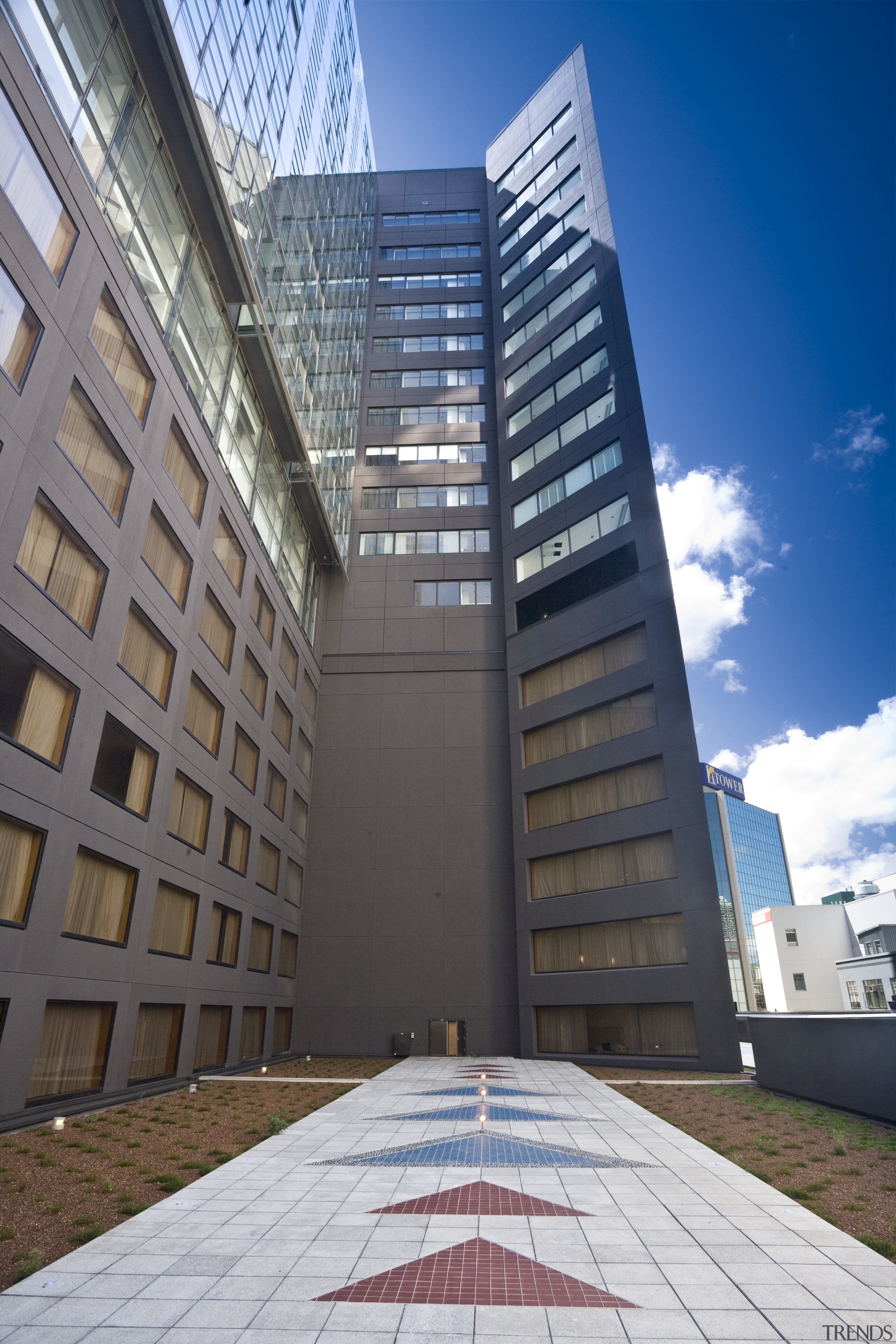 Exterior view of the apartments in Auckland CBD apartment, architecture, building, commercial building, condominium, corporate headquarters, daylighting, daytime, facade, headquarters, landmark, metropolis, metropolitan area, mixed use, real estate, residential area, sky, skyscraper, tower, tower block, urban area, gray