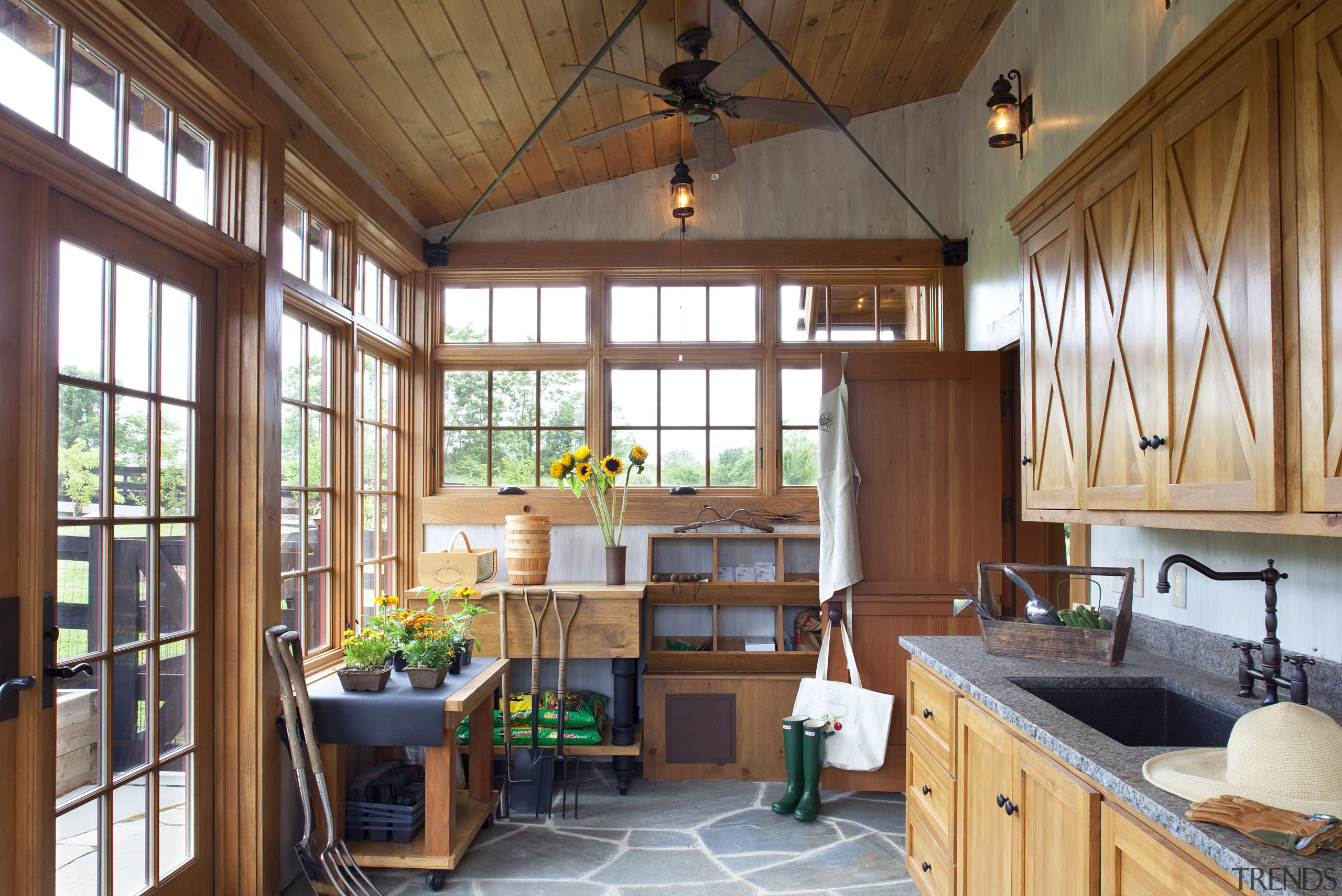 View of kitchen area with wooden cabinets and ceiling, interior design, living room, real estate, room, window, wood, brown