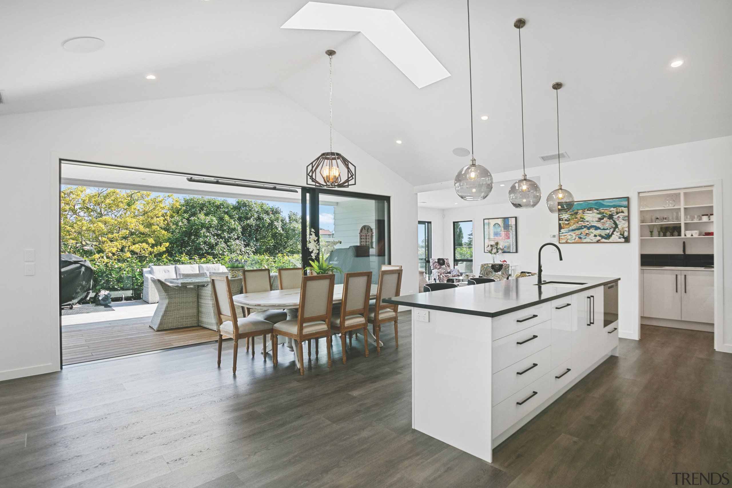 The open-plan kitchen/dining flows seamlessly to a large 