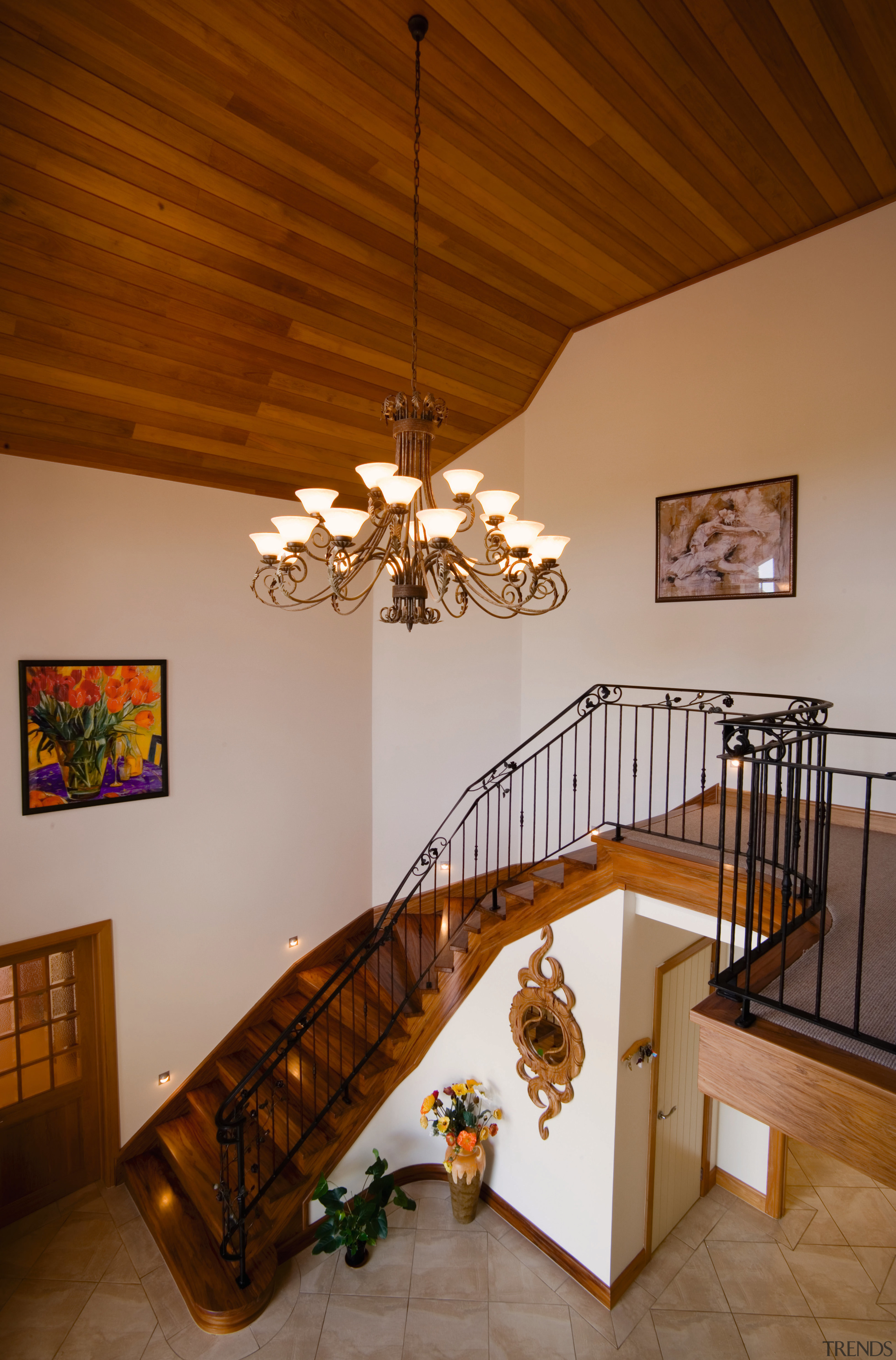 Stairway and foyer area with cream walls and ceiling, chandelier, dining room, estate, floor, handrail, home, house, interior design, light fixture, property, real estate, room, stairs, wood, brown