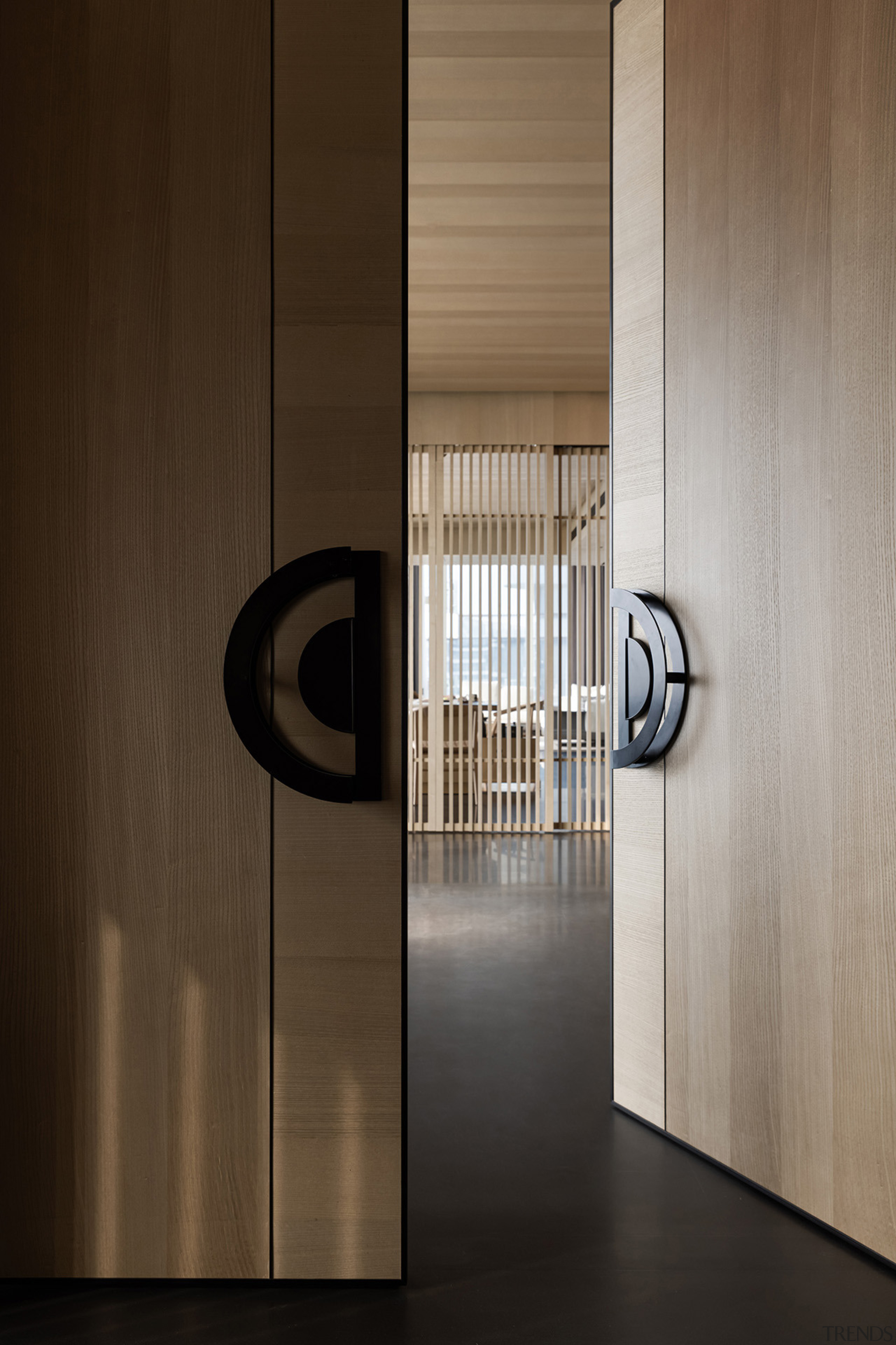 Solid wood entrance doors greet guests to the 