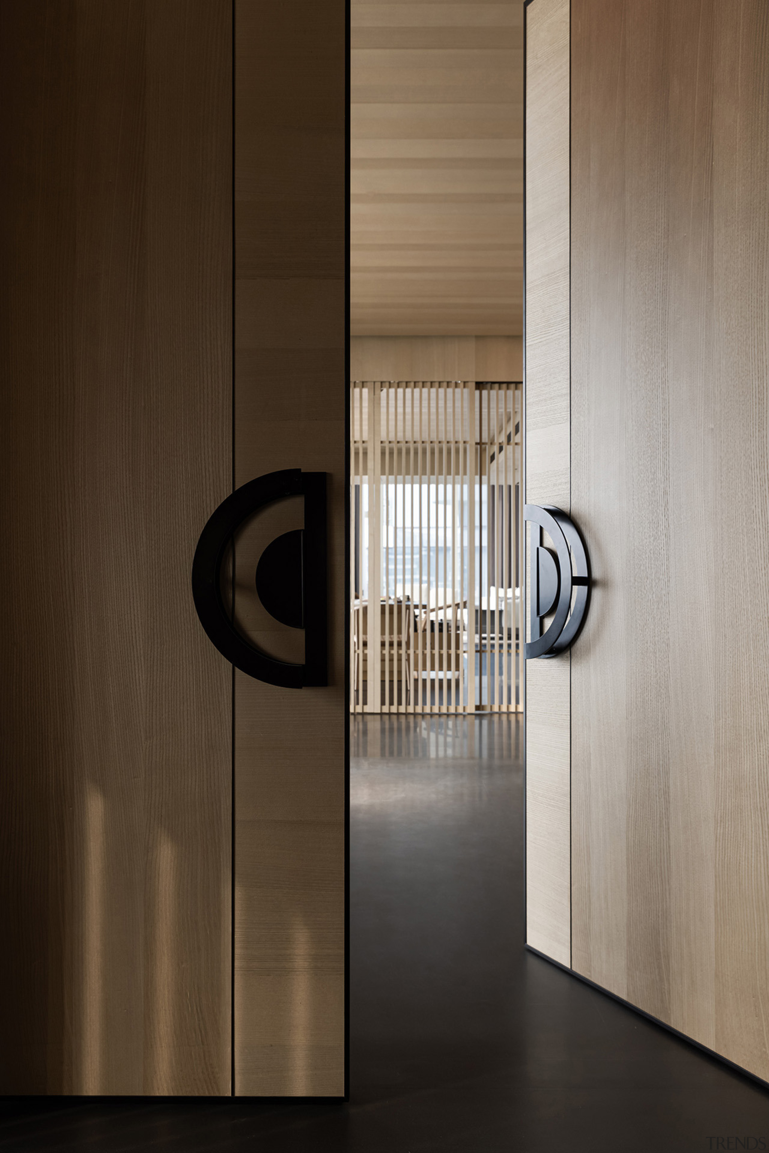 Solid wood entrance doors greet guests to the 