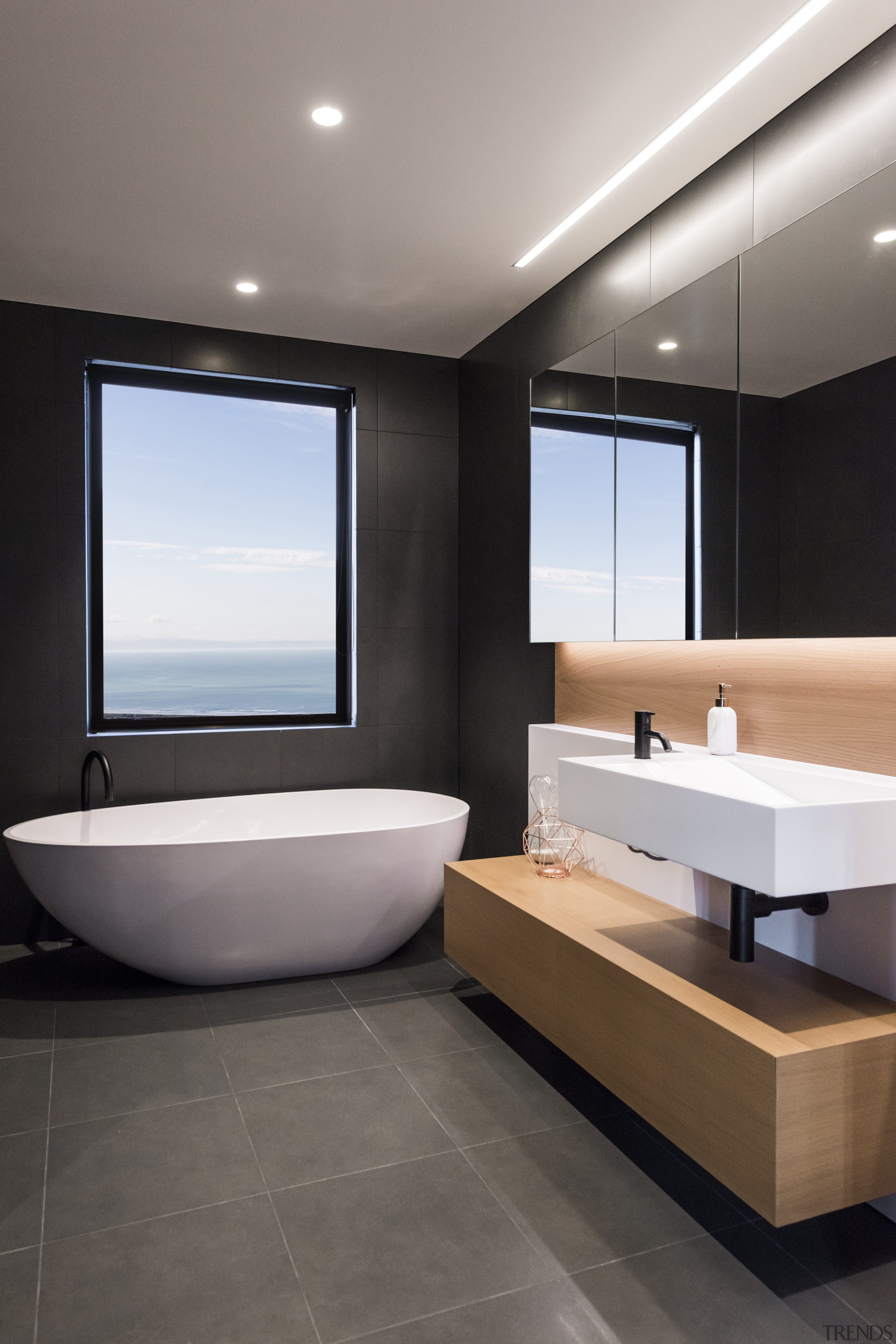 ​​​​​​​To achieve the effect you want in a bathroom, floor, tiles, interior design, sink, gray, black, freestanding bath, timber vanity top, Davinia Sutton