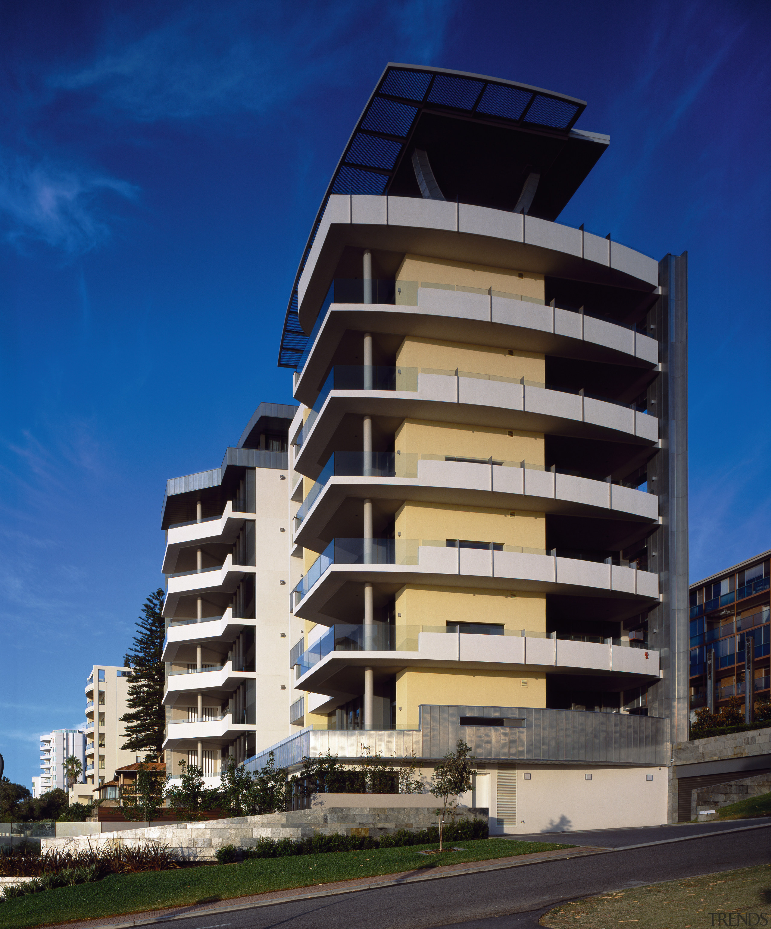 A zinc-cald horseshoe colum on the penthouse balcony apartment, architecture, building, commercial building, condominium, corporate headquarters, facade, headquarters, house, metropolis, metropolitan area, mixed use, real estate, residential area, sky, tower block, blue
