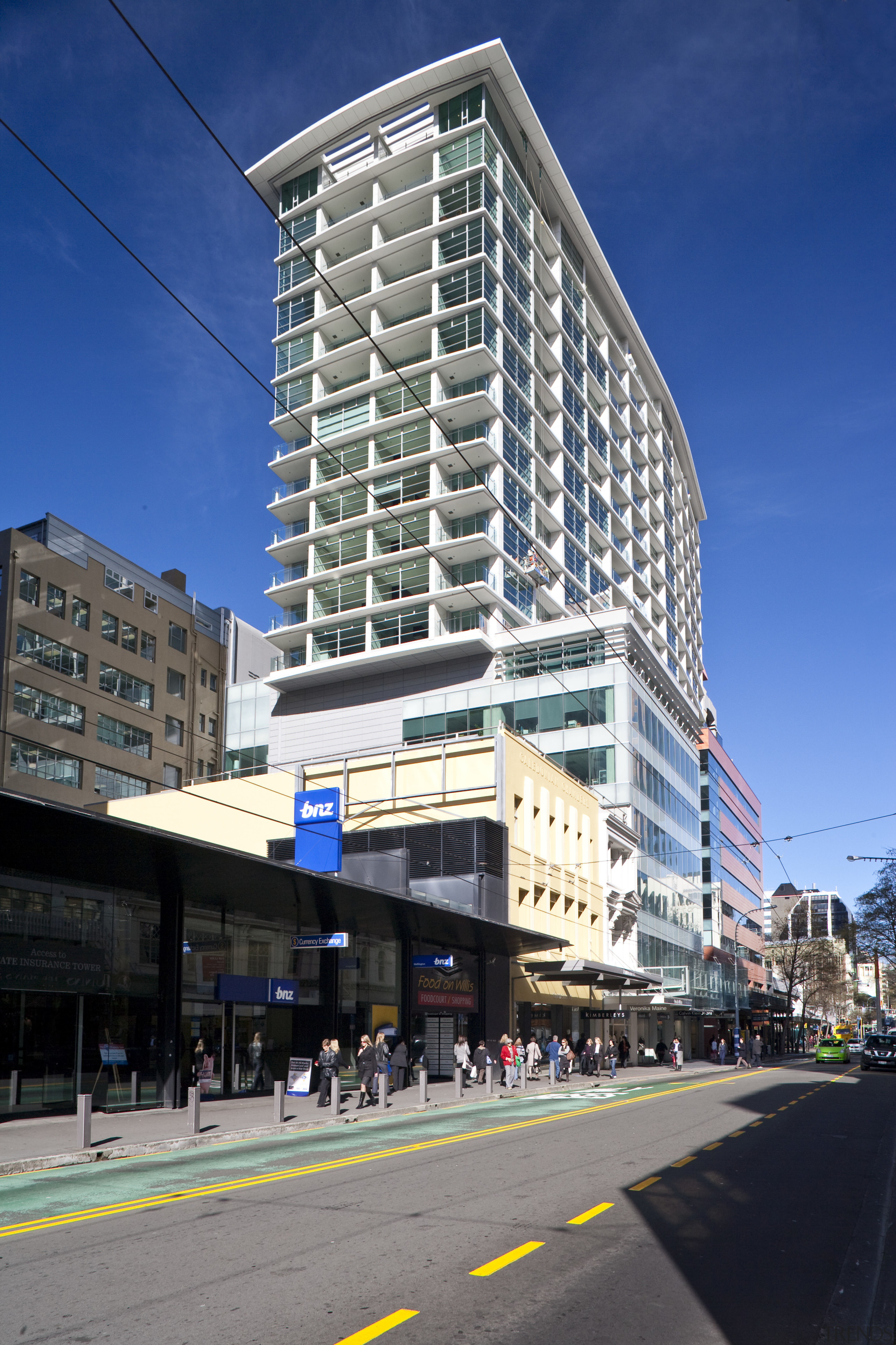 exterior view of apartment building featuring windows and apartment, architecture, building, city, commercial building, condominium, corporate headquarters, daytime, downtown, facade, headquarters, infrastructure, landmark, metropolis, metropolitan area, mixed use, neighbourhood, real estate, residential area, sky, skyscraper, tower block, urban area, blue