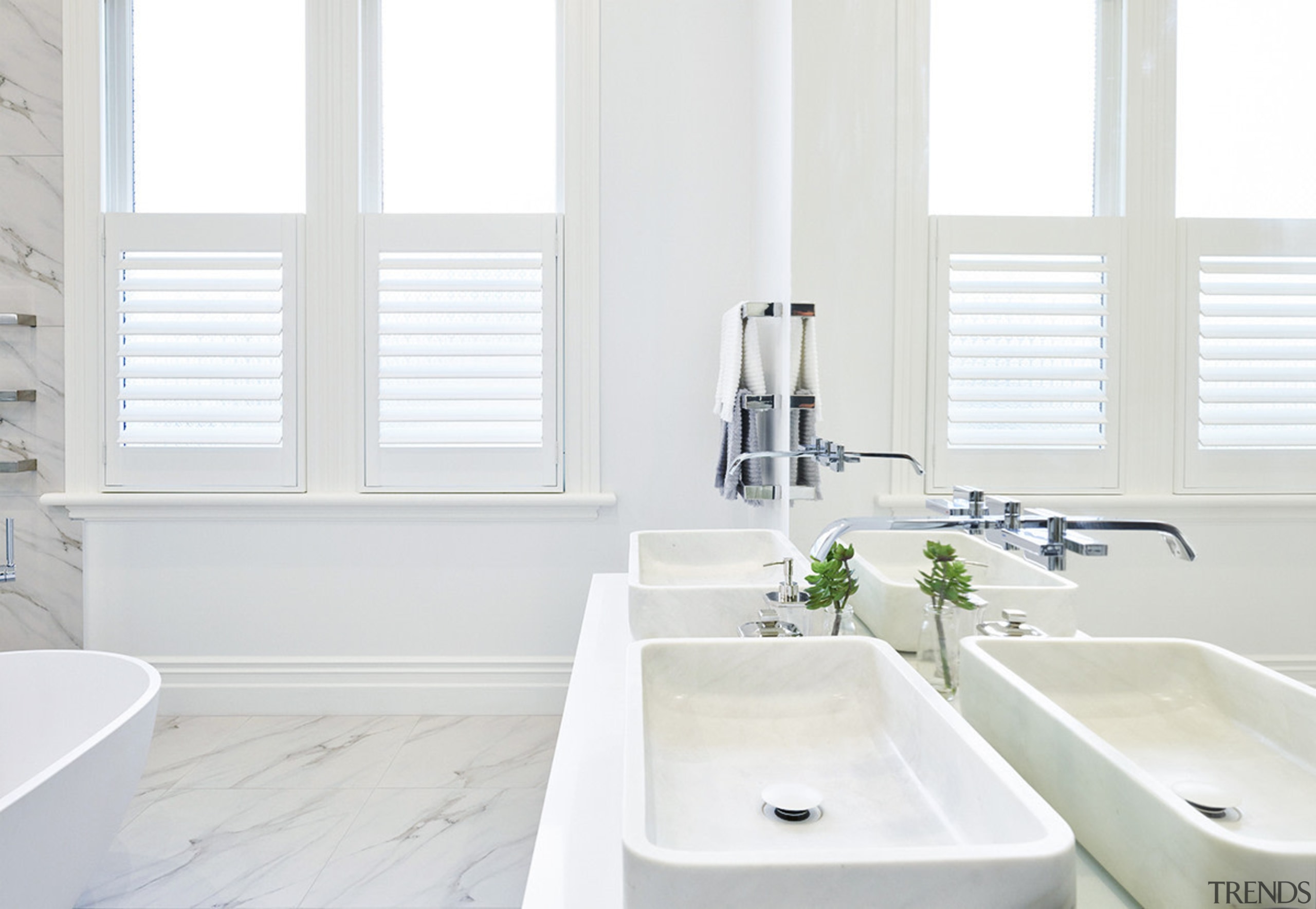 A double basin vanity treads a line between bathroom, bathroom accessory, bathroom sink, home, interior design, plumbing fixture, product, room, sink, tap, window, white