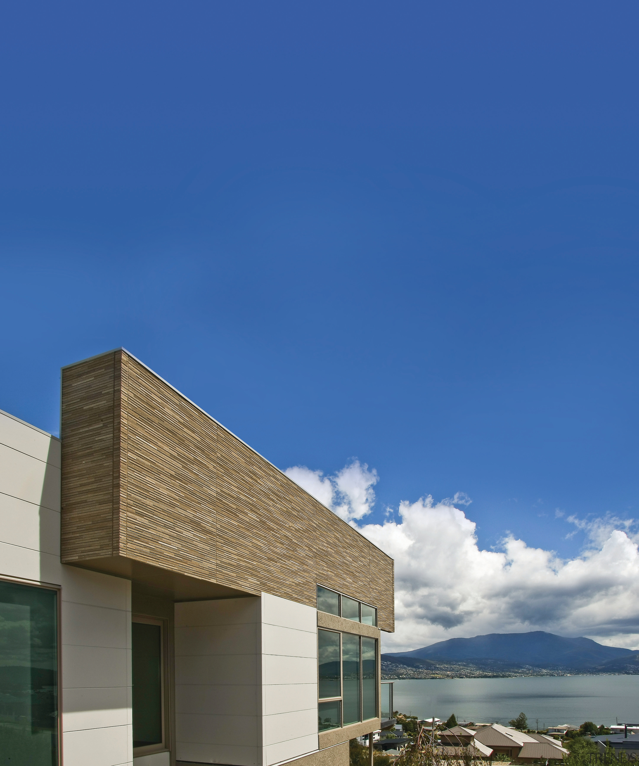 Designer Series Sandstone textured panels provide an attractive architecture, building, cloud, corporate headquarters, daytime, elevation, facade, home, house, real estate, sky, blue