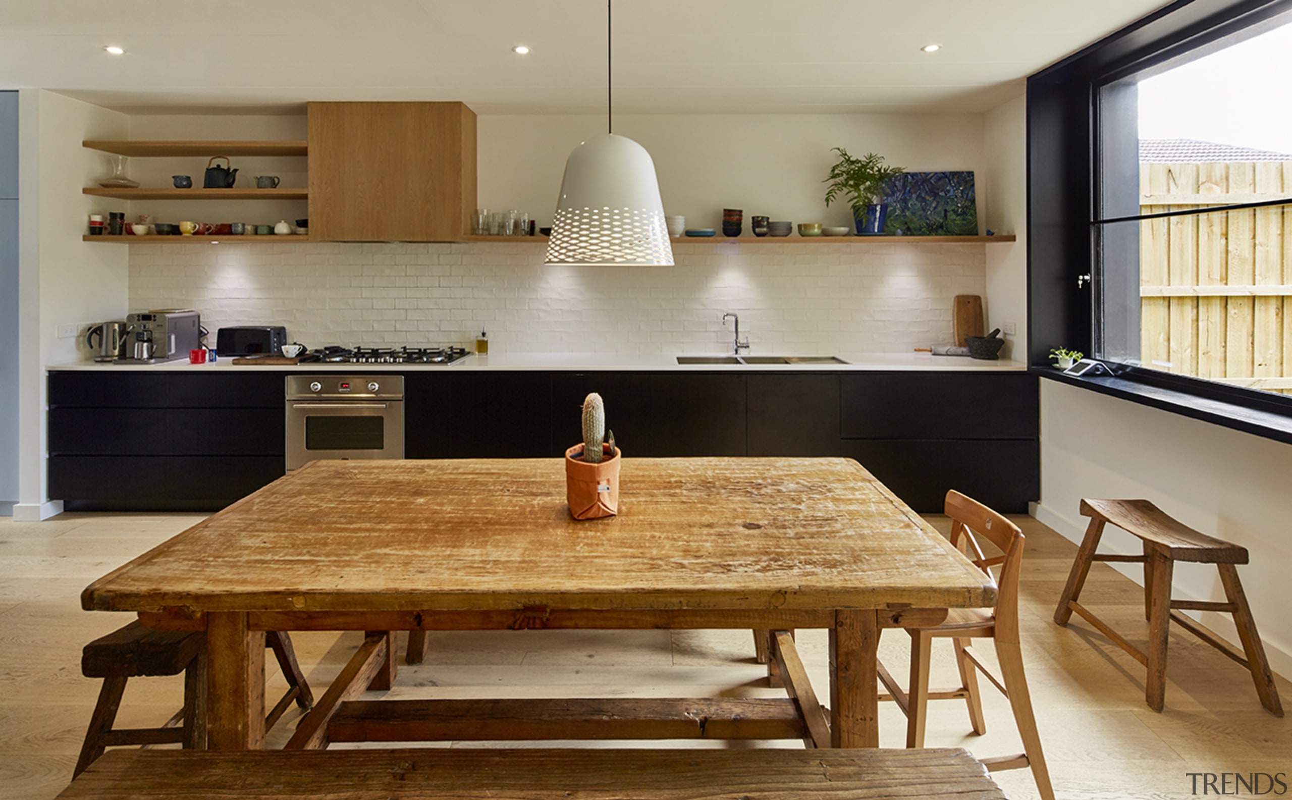 This open-plan kitchen in a Modscape-designed Brunswick architecture, building, cabinetry, ceiling, coffee table, countertop, dining room, floor, flooring, furniture, hardwood, home, house, interior design, kitchen, light fixture, lighting, plywood, property, real estate, room, table, tile, wall, wood, wood flooring, brown, gray