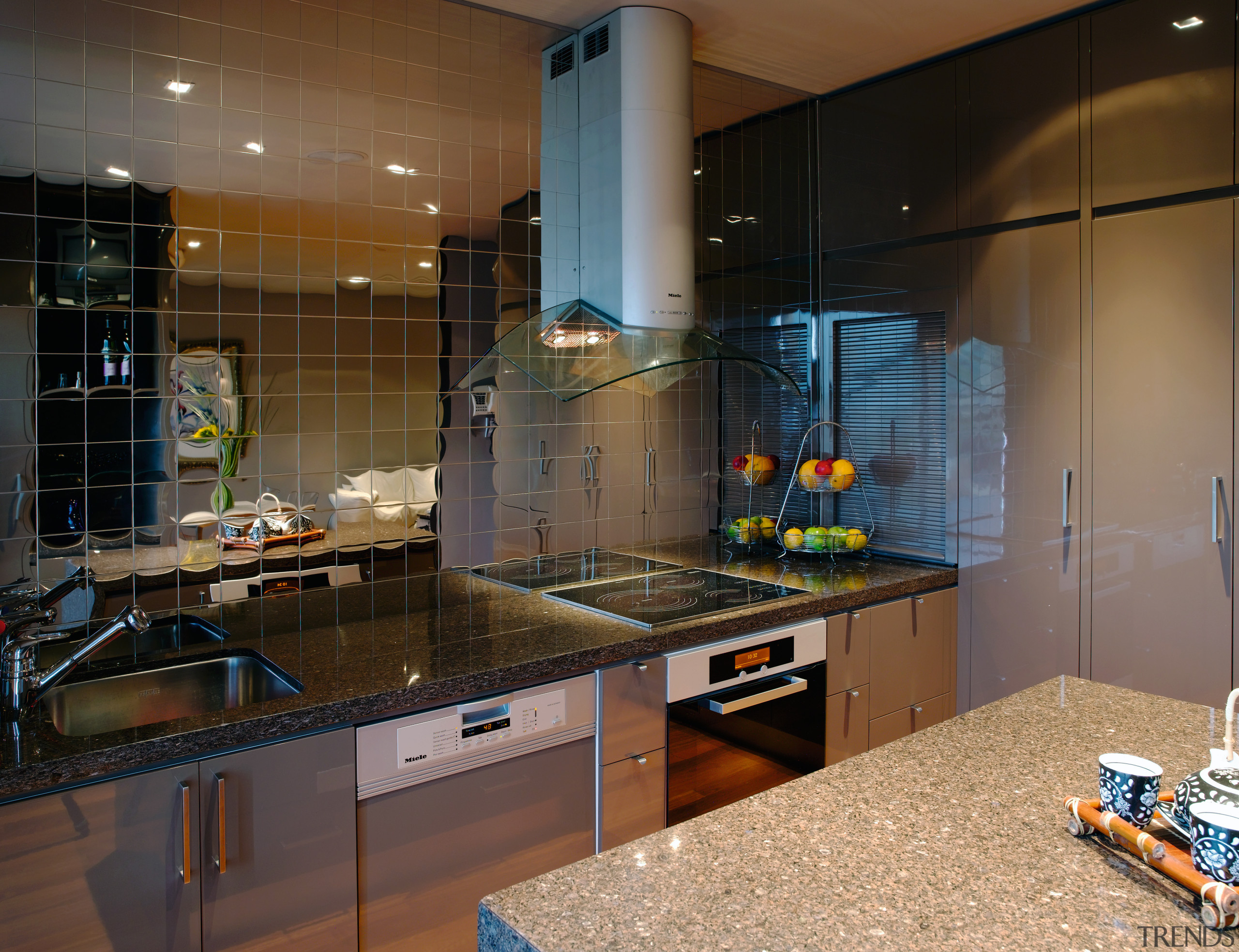A vie wof some alloy kitchen tiles by countertop, interior design, kitchen, room, under cabinet lighting, black, brown