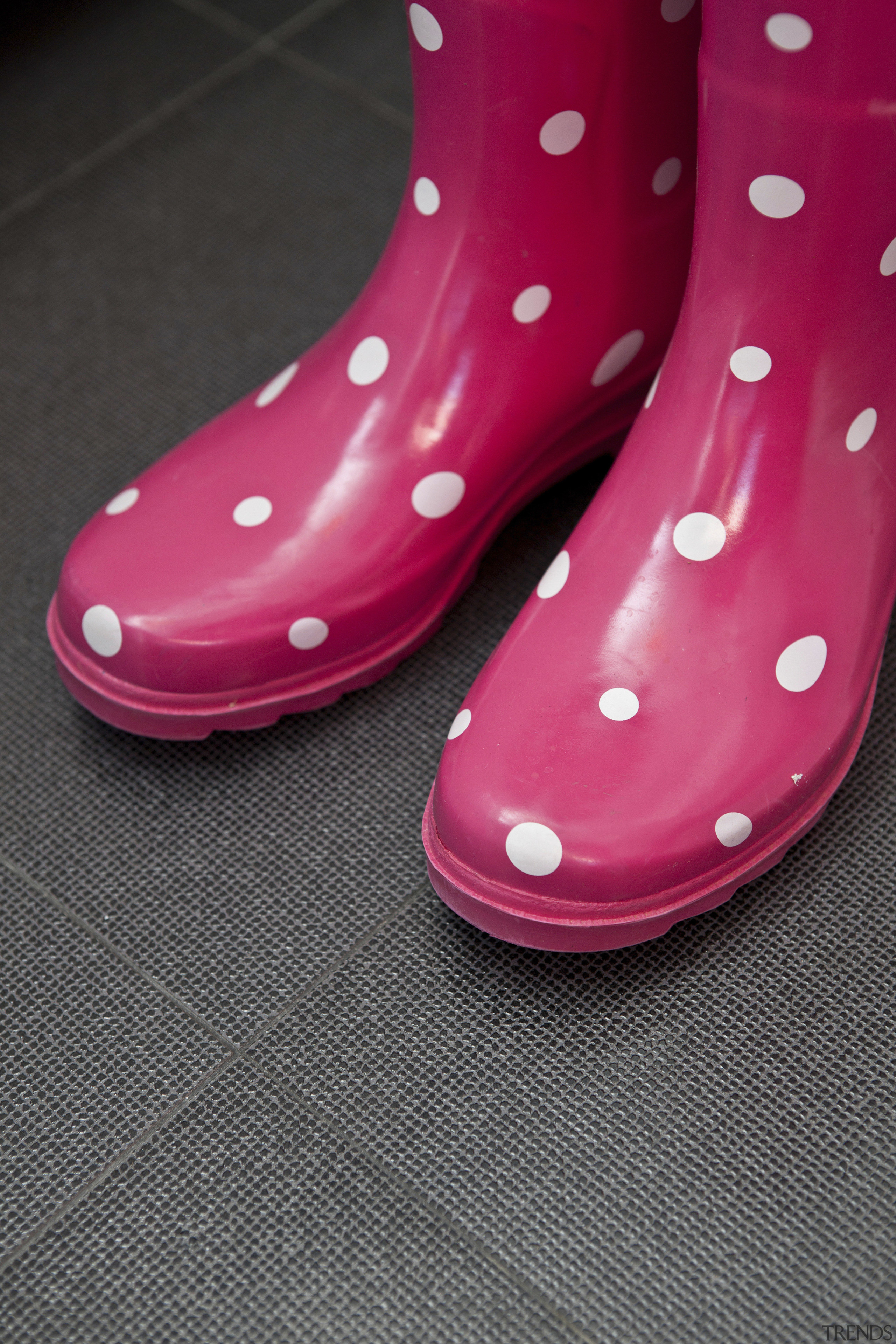 Pink gumboots with white spots. - Pink gumboots design, footwear, high heeled footwear, magenta, outdoor shoe, pink, product design, shoe, black, red