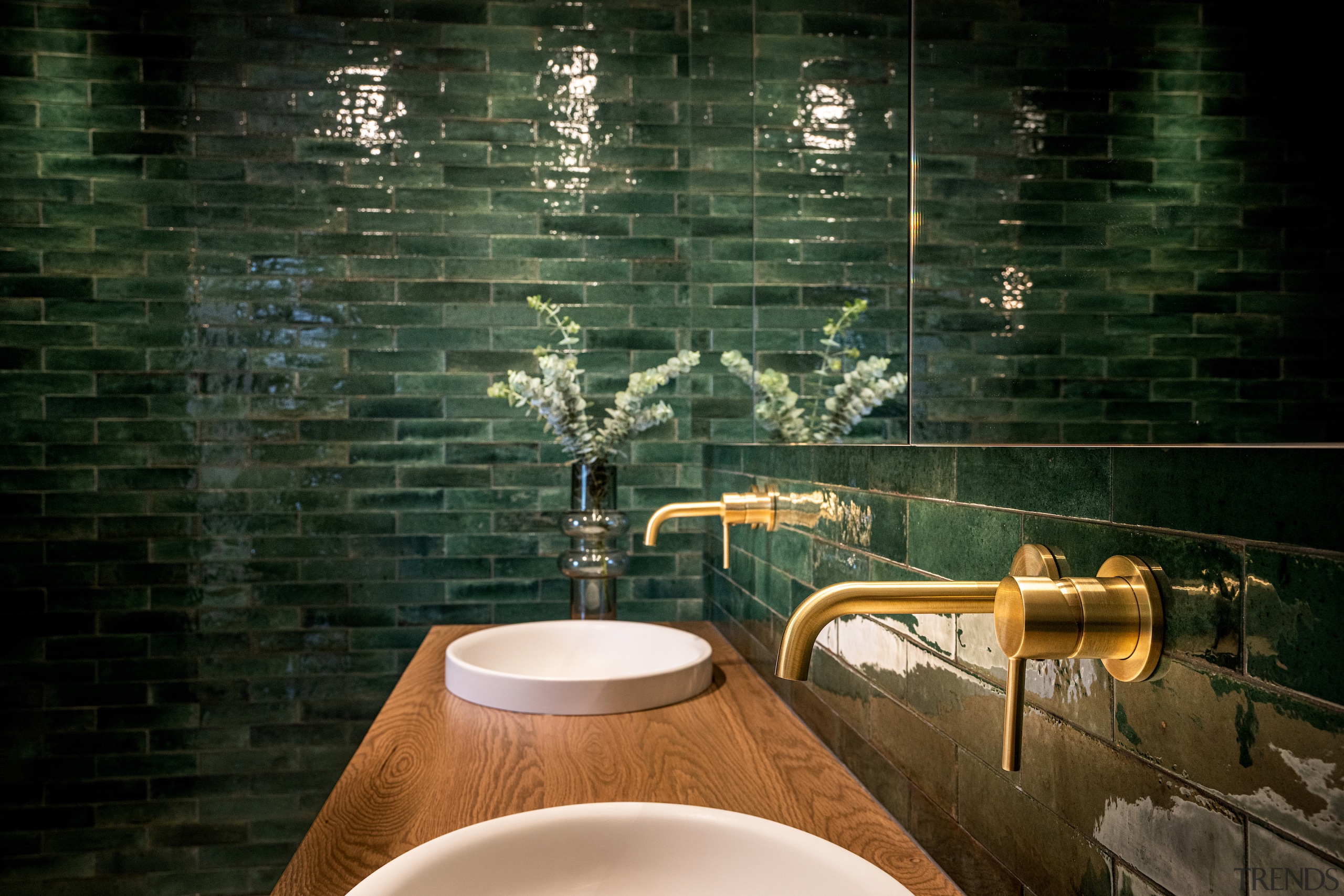 Wood vanity, brass-finished taps and 'Lume' coloured tiles 