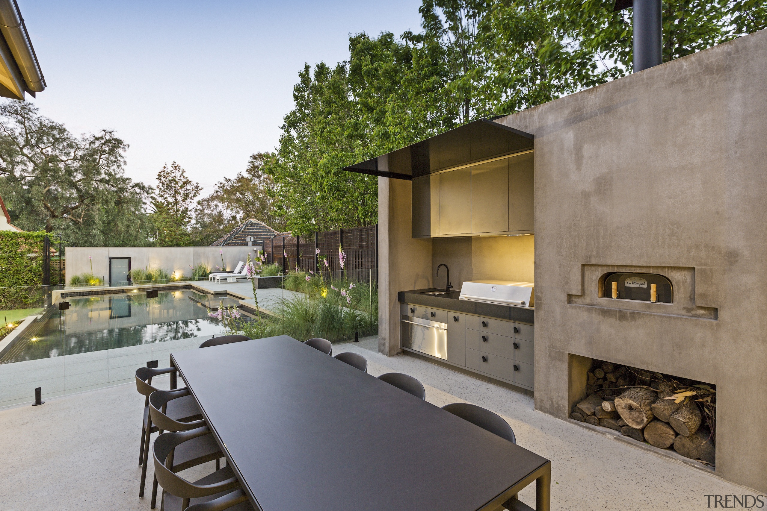 An outdoor kitchen, fireplace and al fresco dining 