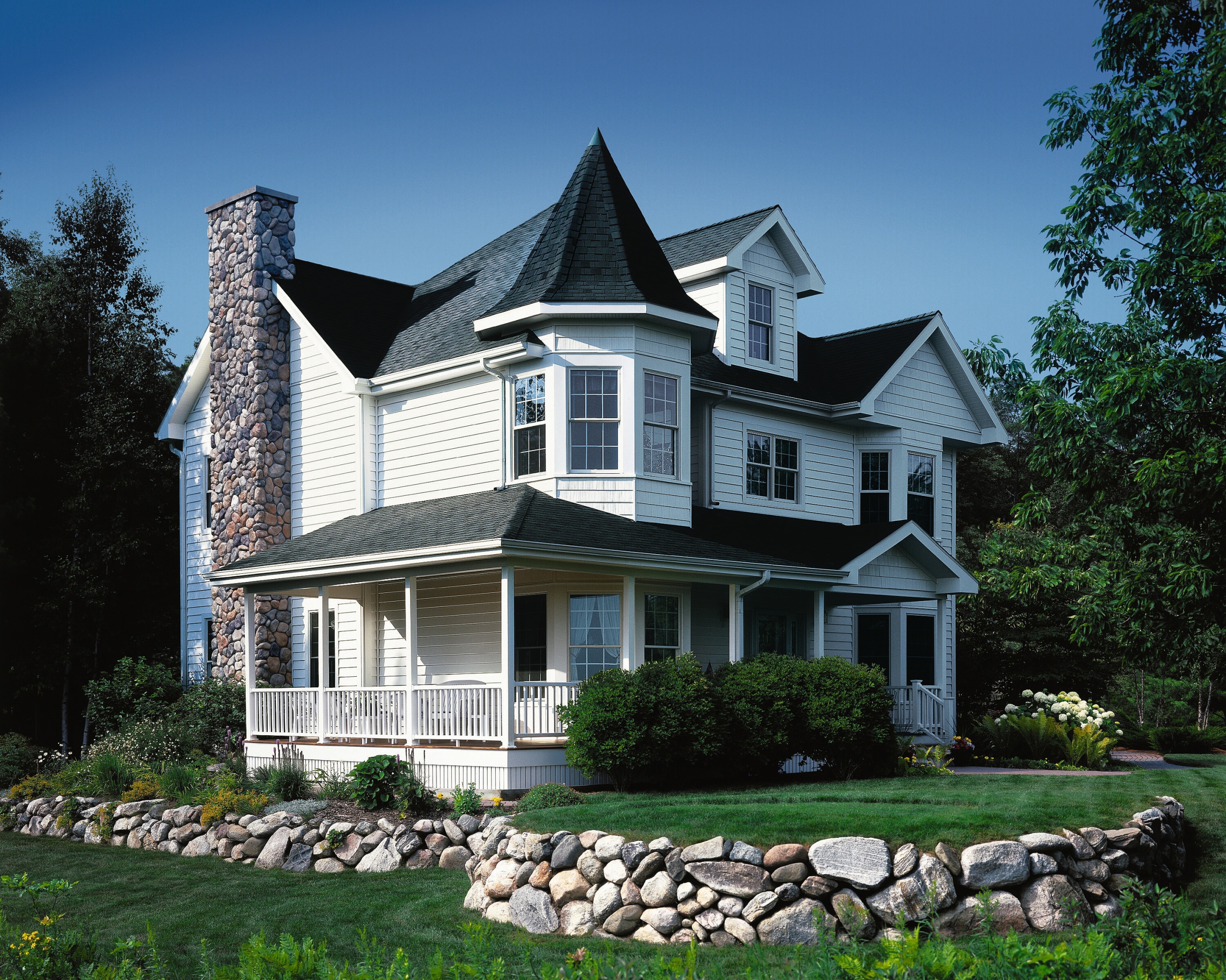 view of this house featuring crane board performance architecture, building, cottage, elevation, estate, facade, farmhouse, historic house, home, house, mansion, neighbourhood, property, real estate, residential area, roof, siding, suburb, window, black