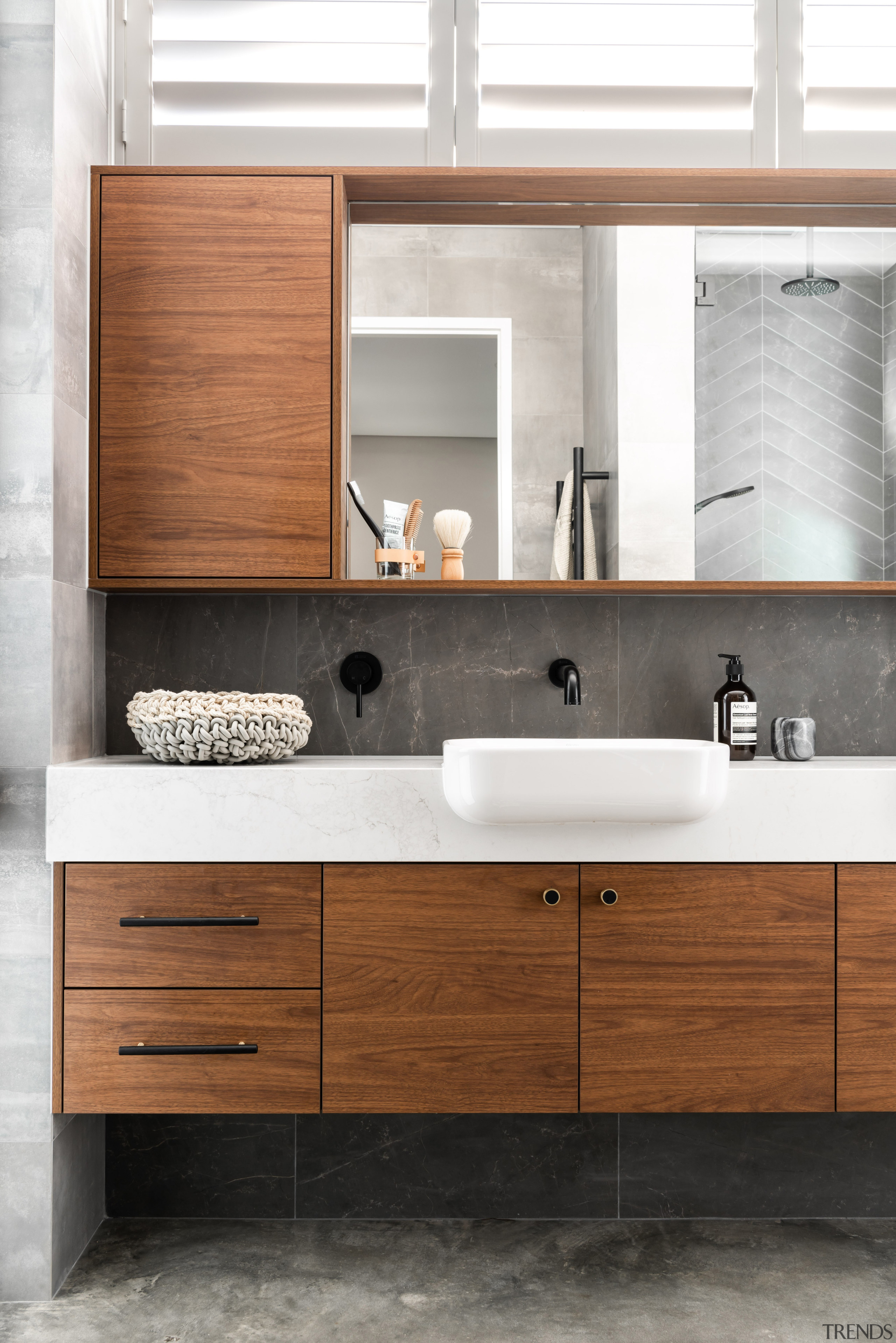 ​​​​​​​This master ensuite has a luxury aesthetic with architecture, bathroom, bathroom accessory, bathroom cabinet, cabinetry, ensuite, countertop, drawer, floor, plumbing fixture, sink, tap, tile, white, vanity, luxury, Dalecki Design