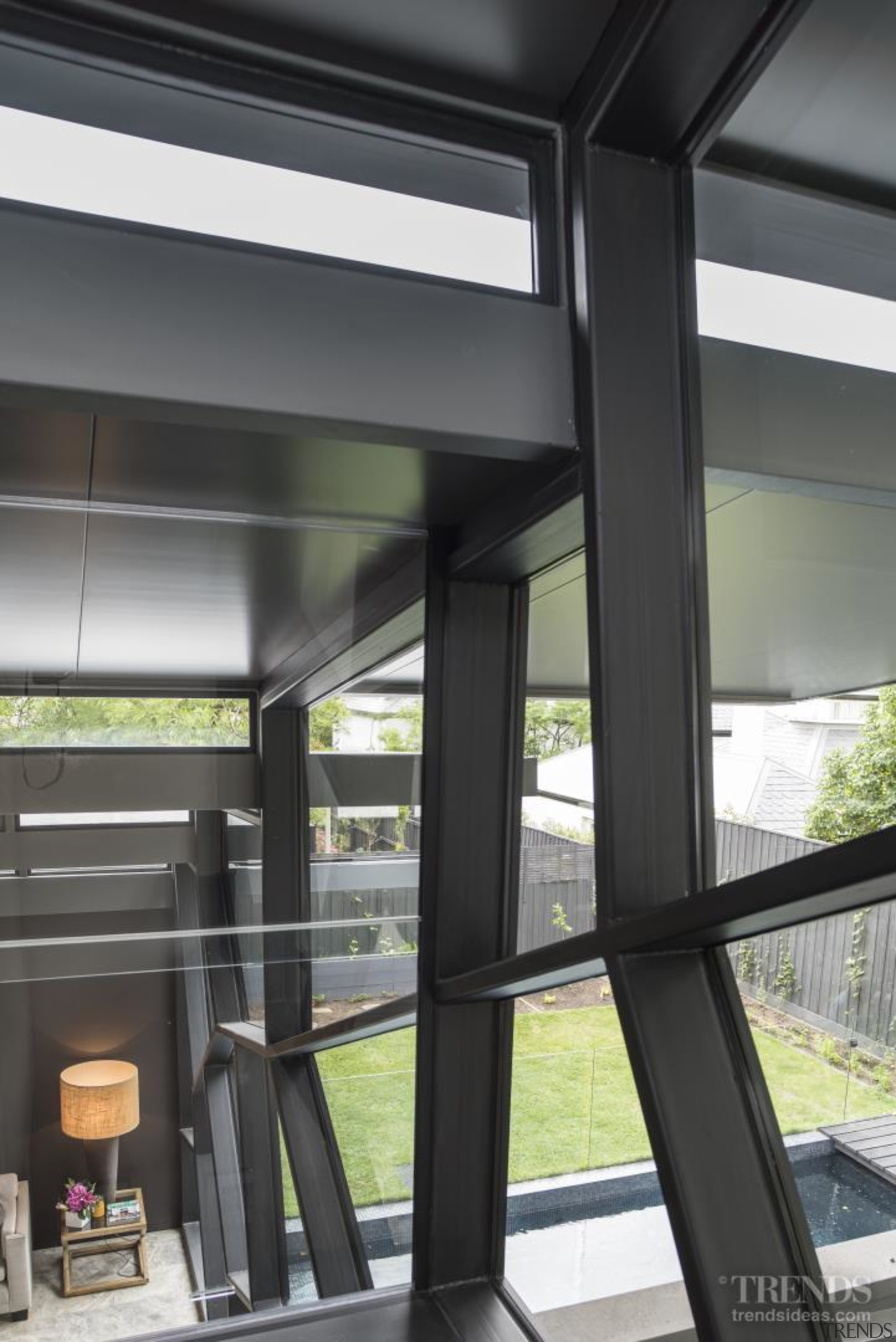 The steel fenestration of this feature window is architecture, glass, window, black, gray